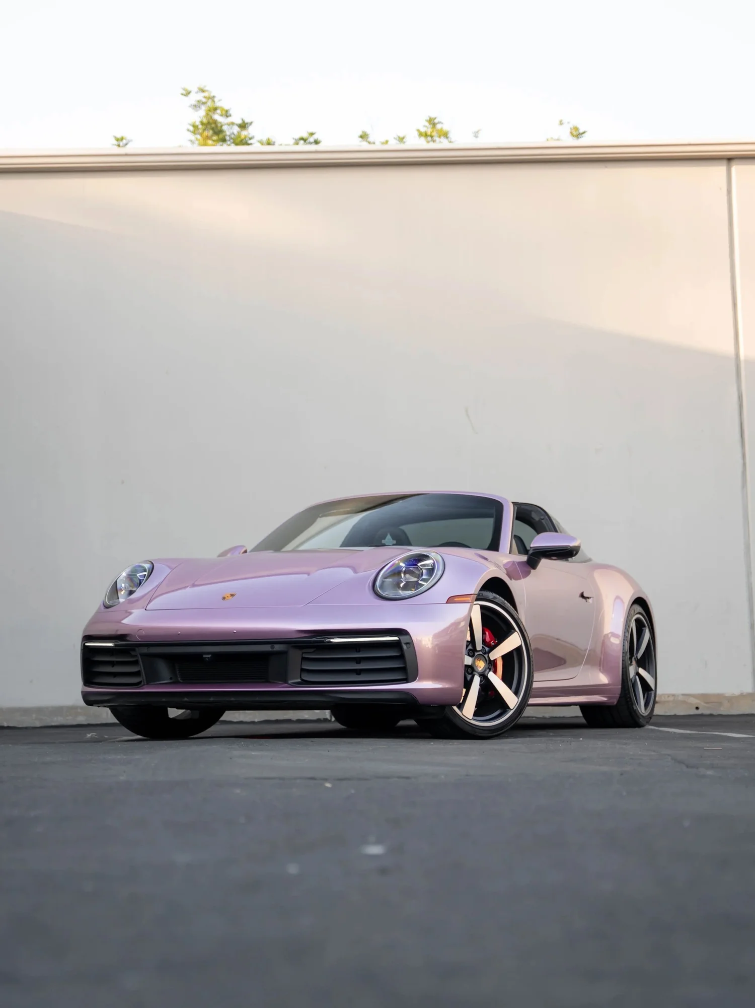 Porsche 911 Metallic Pink after Vinyl Wrap, low-angle front view