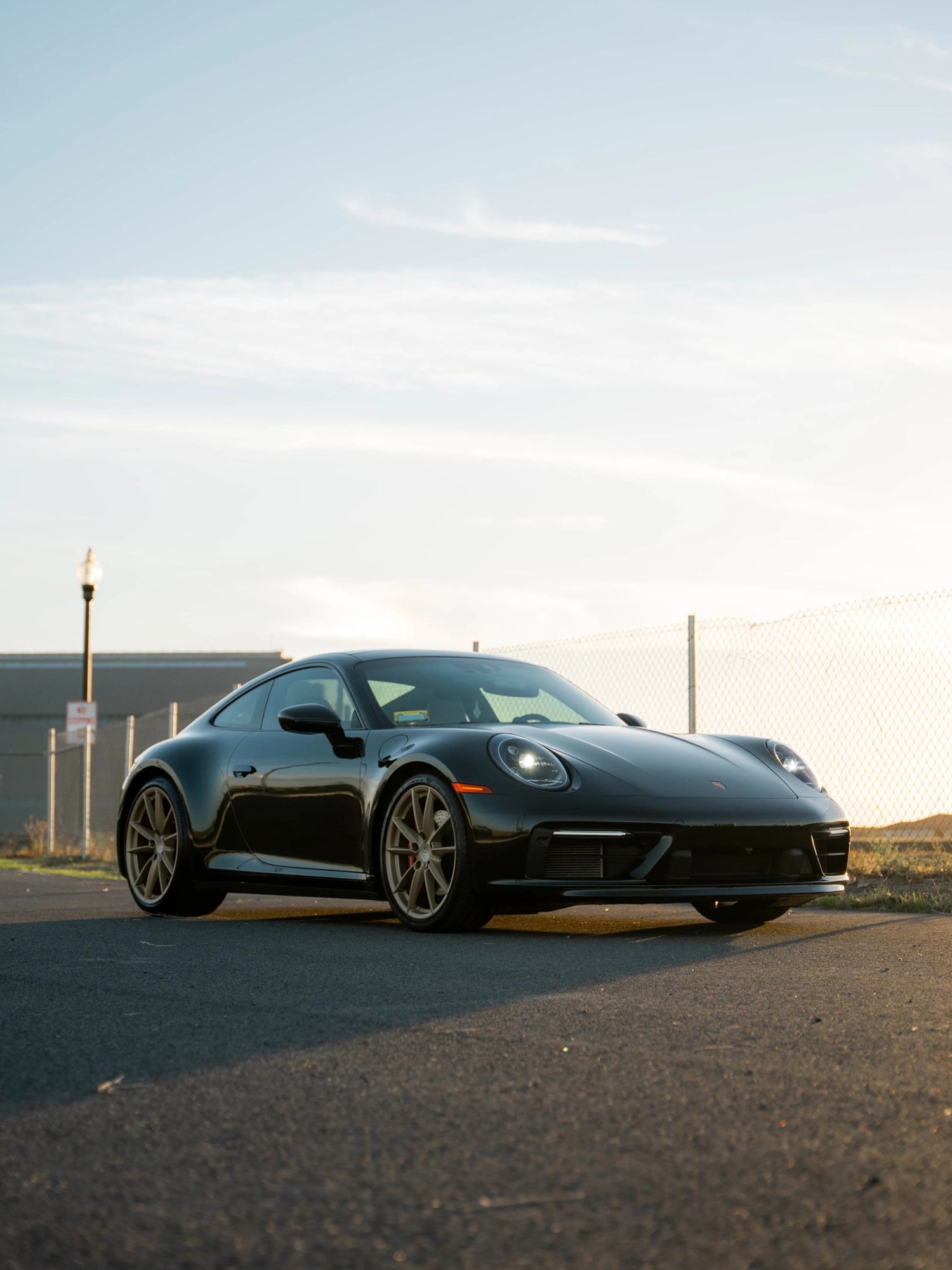 Porsche 911 Carrera Wrapped in British Green after Vinyl Wrap, low-angle front view