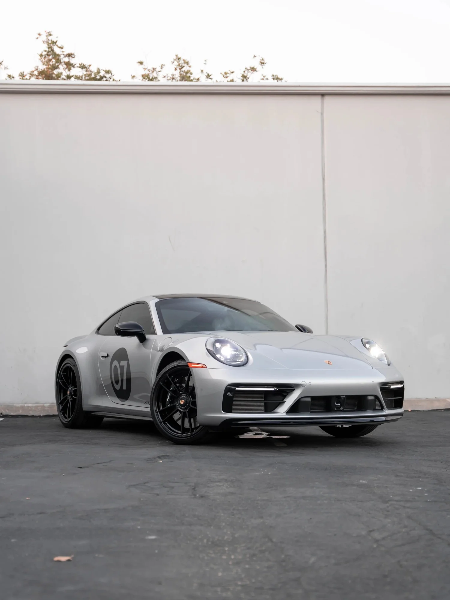 Porsche 911 Carrera GTS (992.1) after Paint Protection Film (PPF), Window Tint, Ceramic Coating and Custom Graphics, front-left three-quarter view