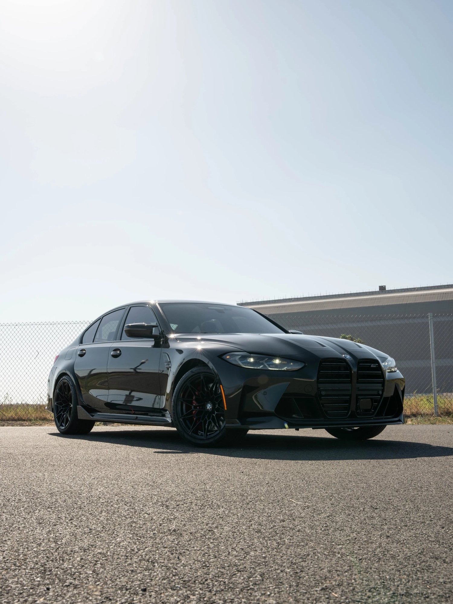 Black BMW M3 after Paint Protection Film (PPF), Window Tint and Ceramic Coating, alternate angle of front-left three-quarter view