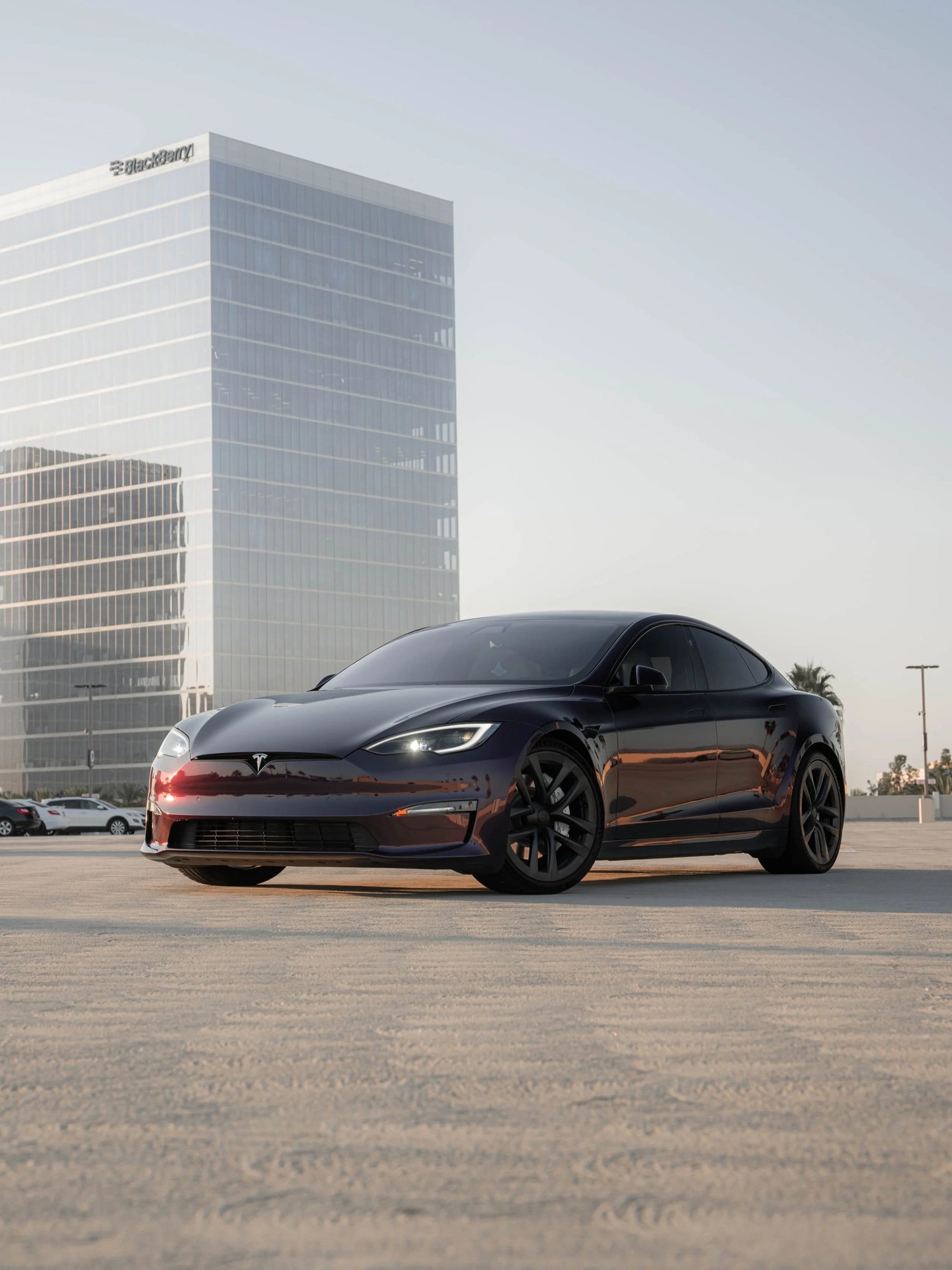 Tesla Model S Midnight Purple after Vinyl Wrap, front-left three-quarter view