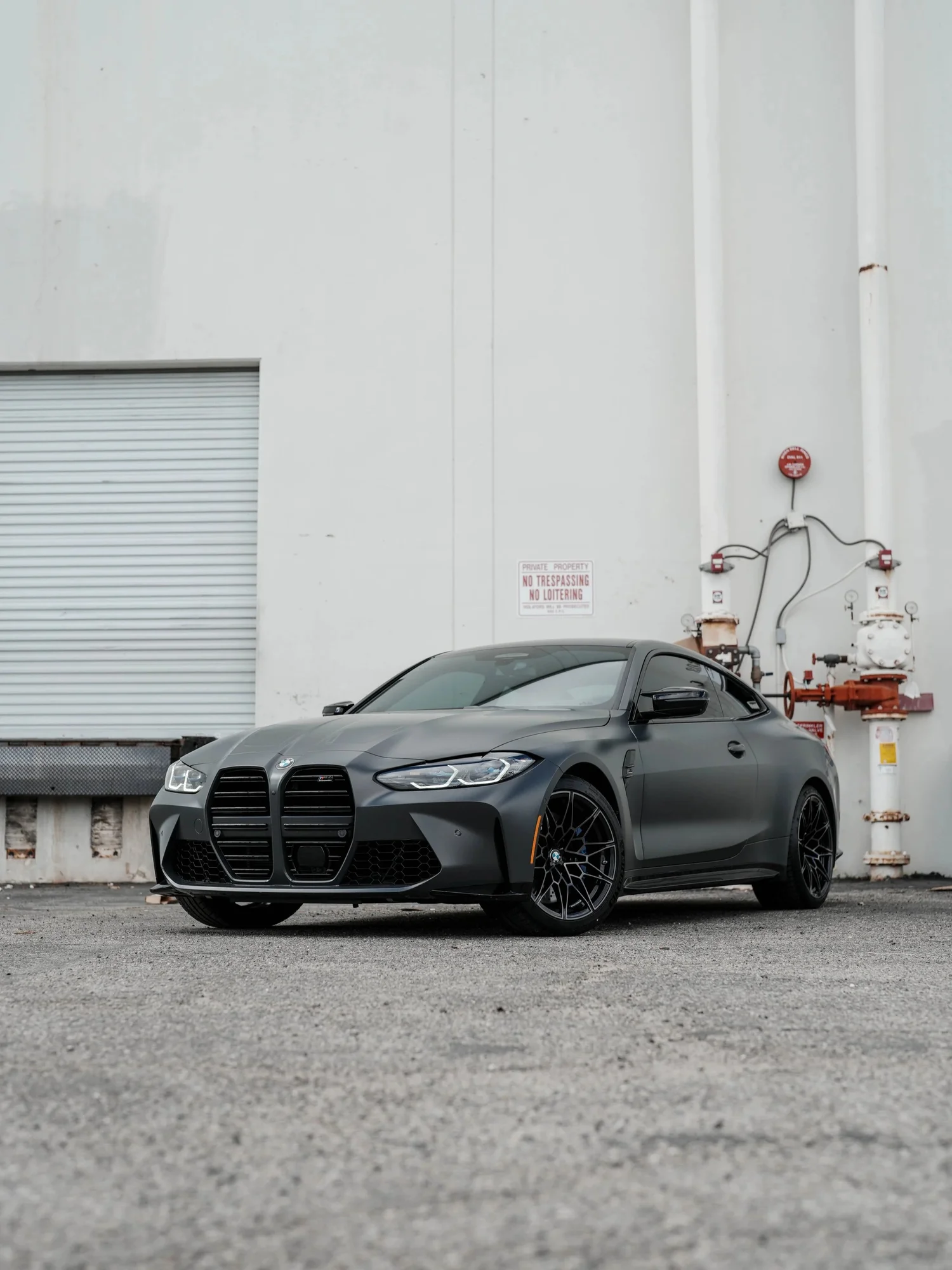 Black BMW M4 after Matte PPF, Window Tint and Ceramic Coating, front-left three-quarter view
