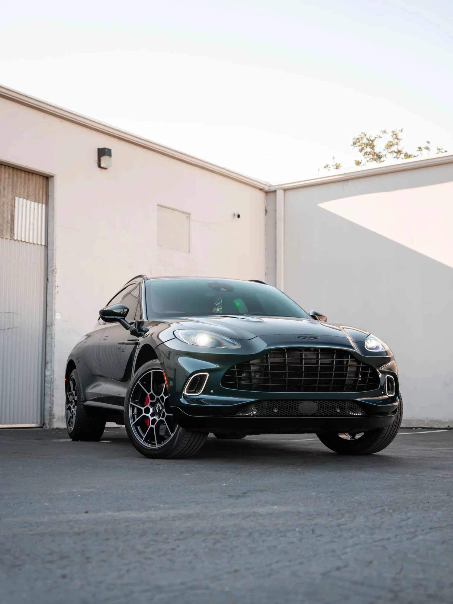 Aston Martin DBX after Paint Protection Film (PPF), Window Tint and Ceramic Coating, low-angle front view