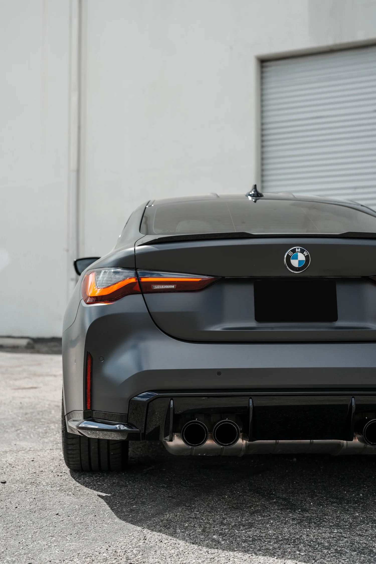 Black BMW M4 after Matte PPF, Window Tint and Ceramic Coating, direct rear view