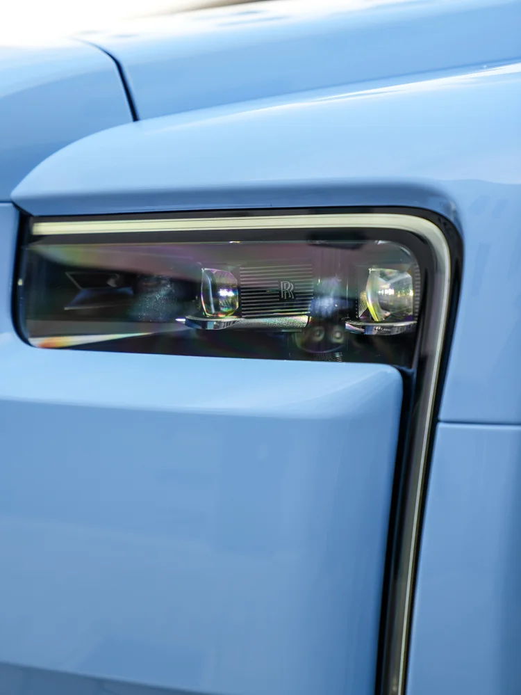 Cullinan rectangular headlight and vertical light trim set into the Powder Blue front bodywork