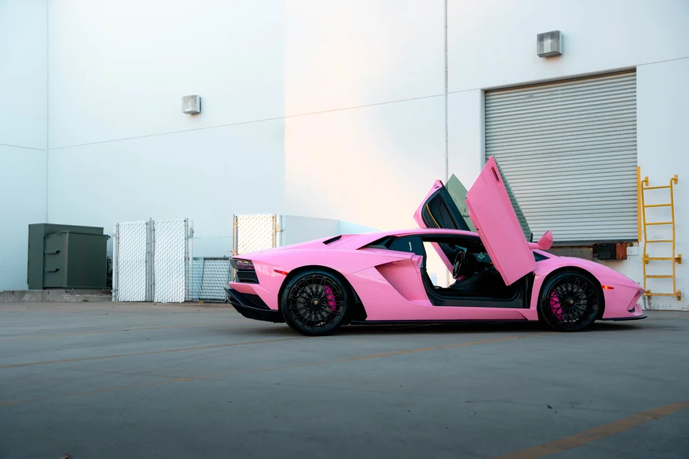 Lamborghini Aventador side view with both scissor doors raised
