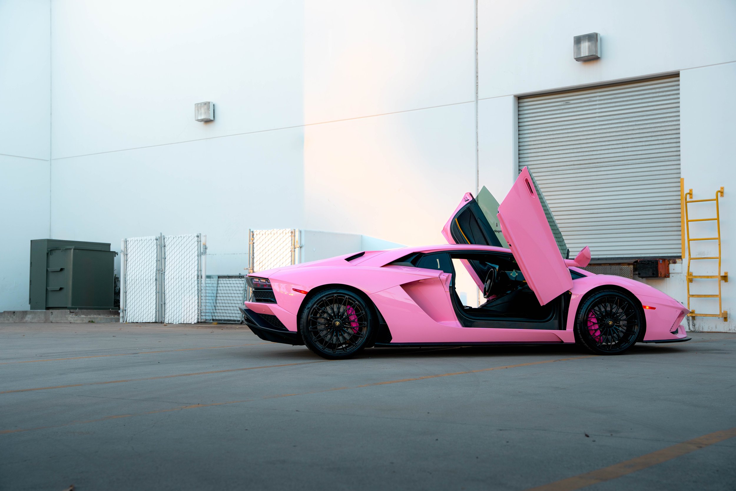 Lamborghini Aventador side view with both scissor doors raised