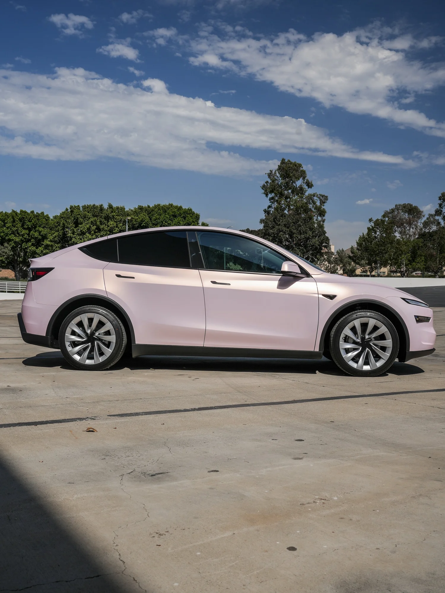 Tesla Model Y Champagne Pink after Vinyl Wrap, left-side profile