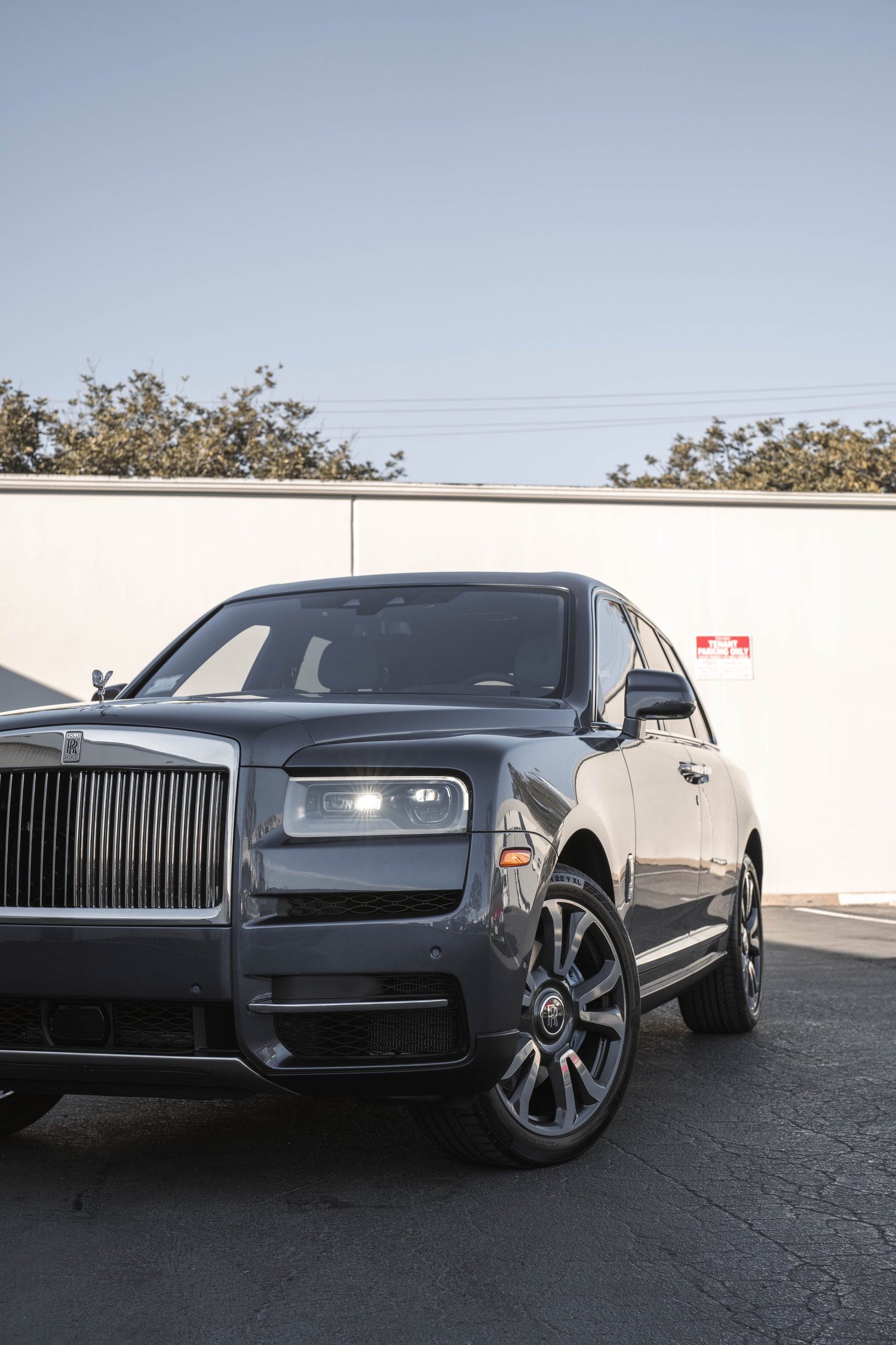 Dark Blue Rolls-Royce Cullinan after Paint Protection Film (PPF), Window Tint and Ceramic Coating, low-angle front view