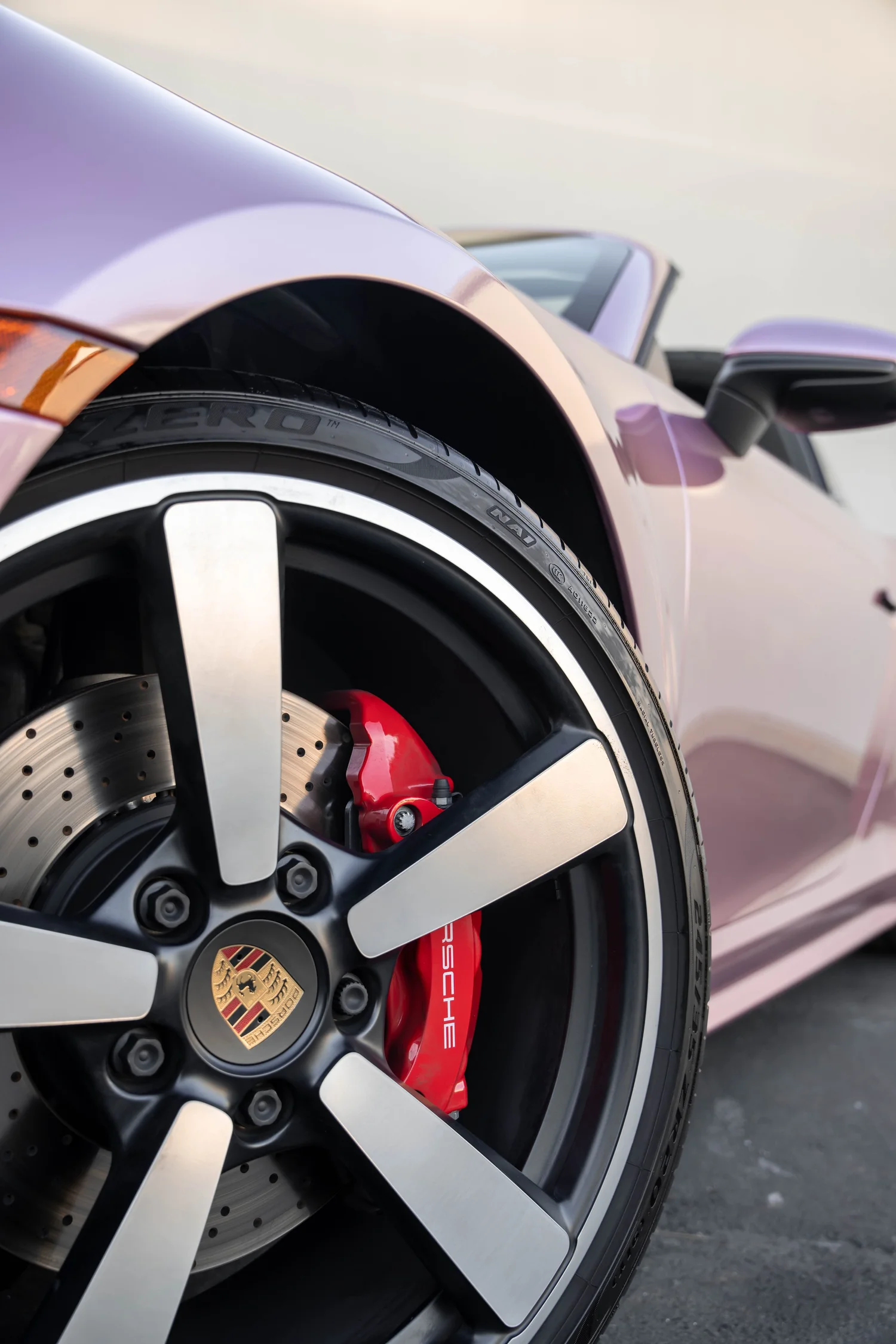 Porsche 911 Metallic Pink after Vinyl Wrap, front-fender and wheel view