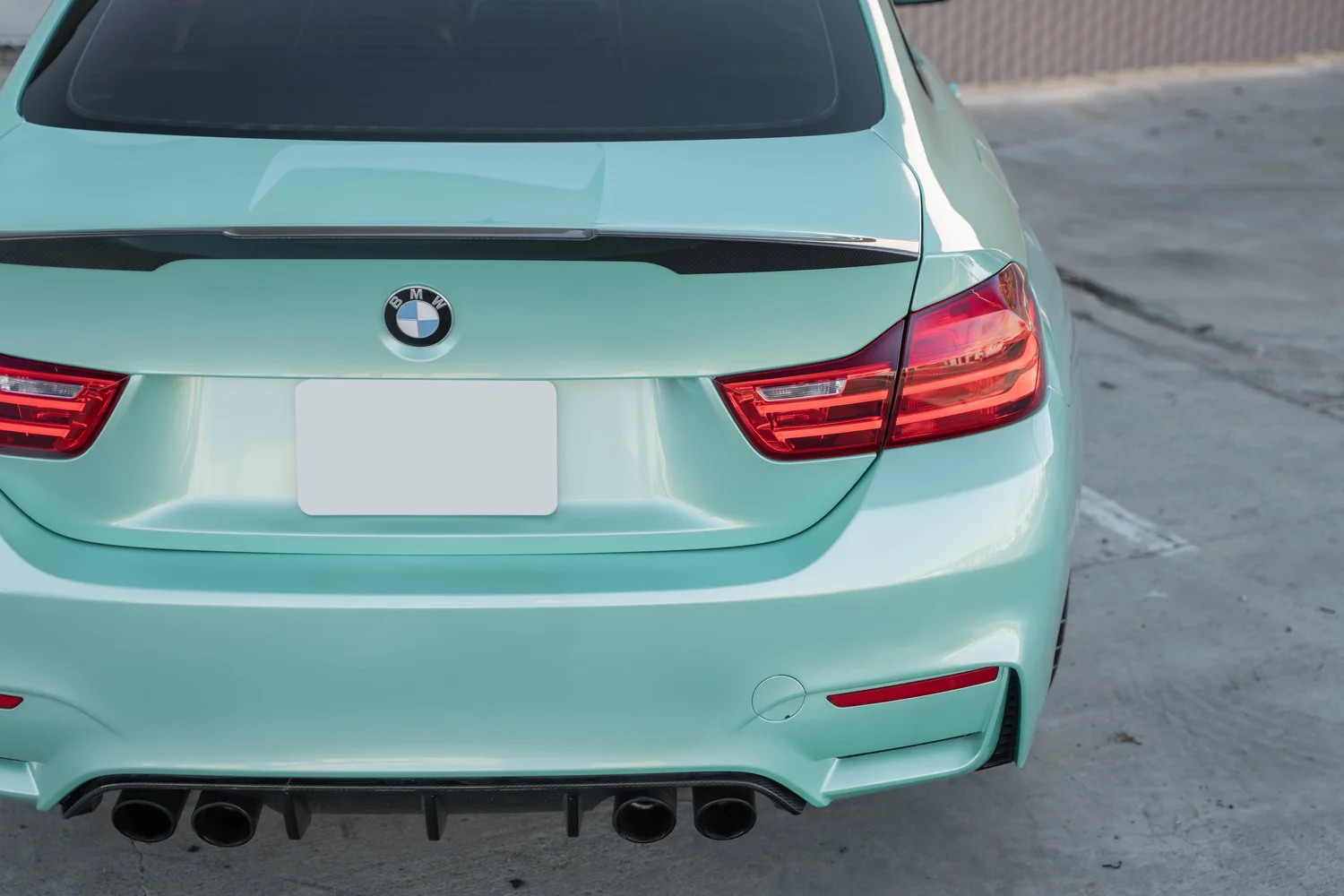BMW M4 Mint Green after Vinyl Wrap, rear bumper and taillight detail