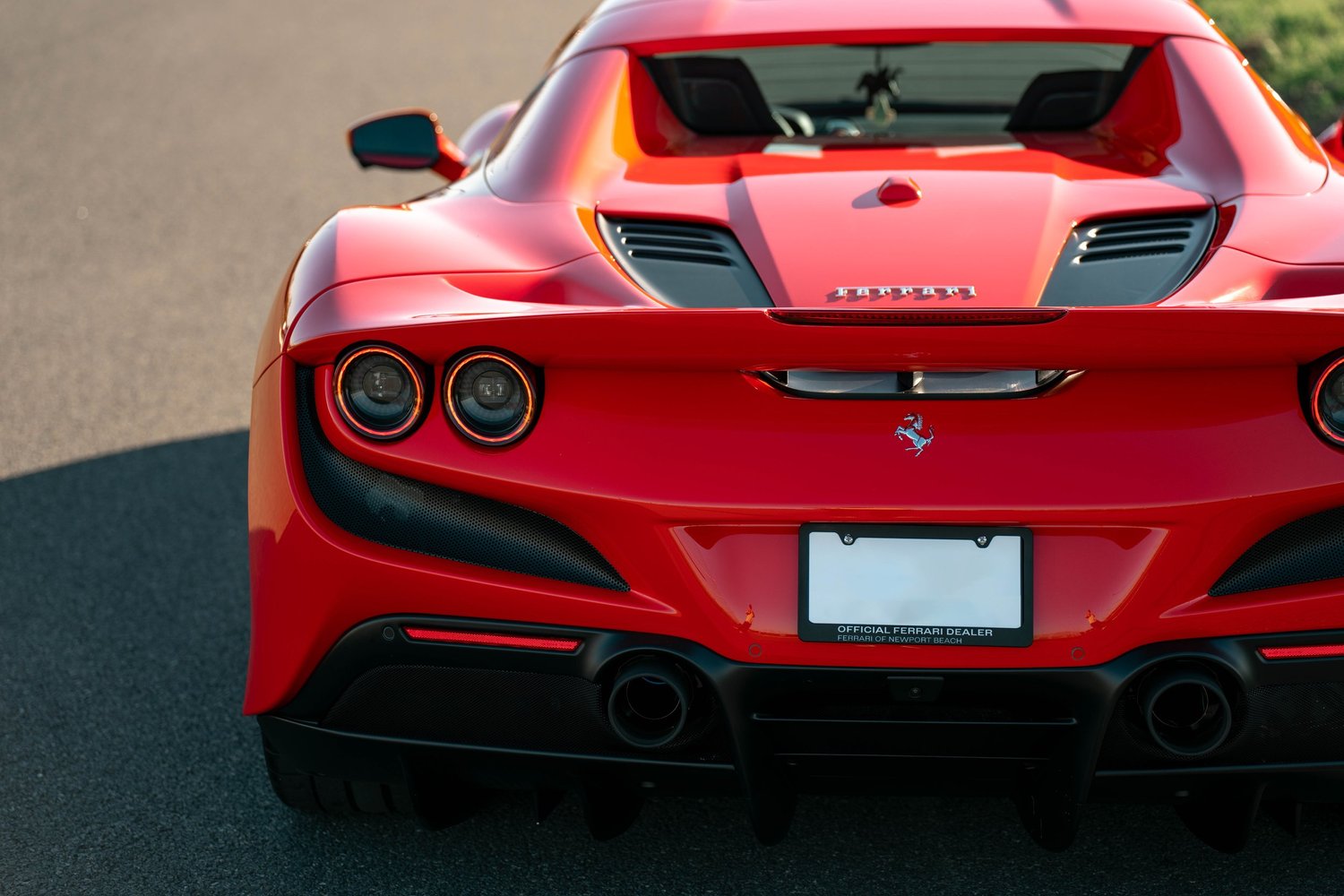 Red Ferrari F8 after Paint Protection Film (PPF), Window Tint and Ceramic Coating, rear body and taillight view