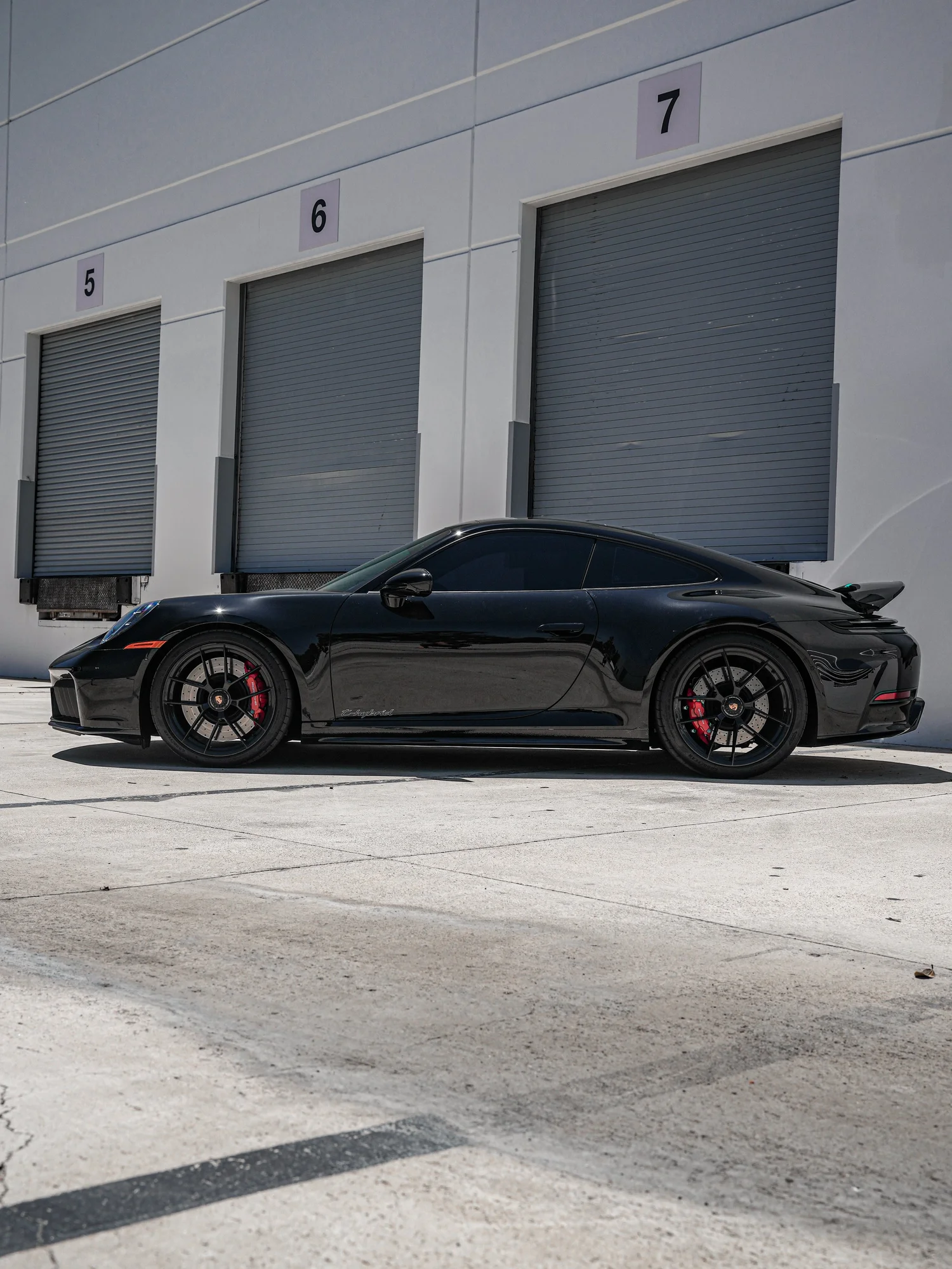 Porsche 911 Carrera 4 GTS (992.2) Custom Decals after Custom Graphics, rear-right three-quarter view
