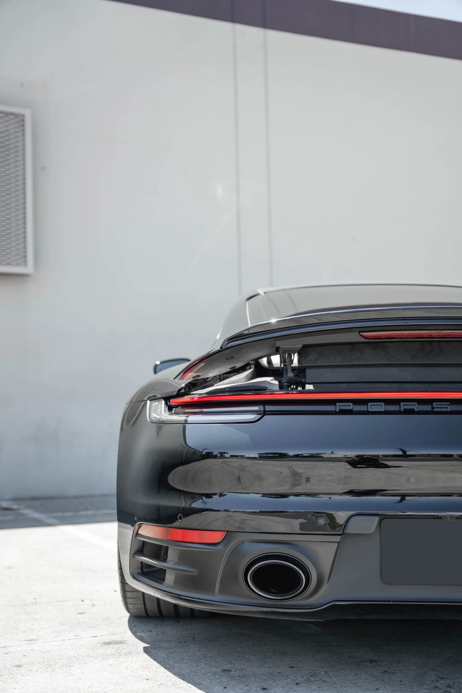 Porsche 911 Carrera S (992.1) after Paint Protection Film (PPF) and Ceramic Coating, direct rear view