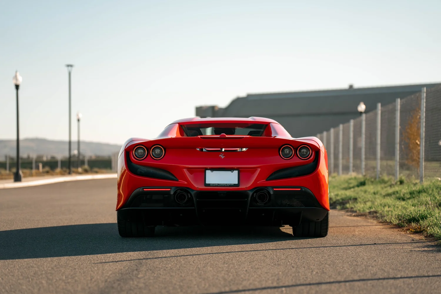 Red Ferrari F8 after Paint Protection Film (PPF), Window Tint and Ceramic Coating, low-angle rear view