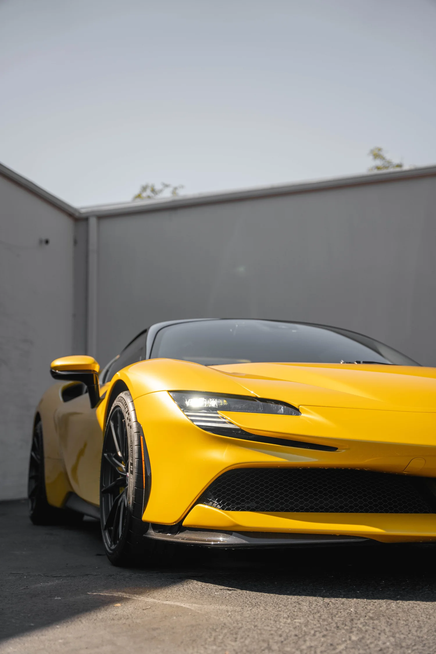 Ferrari SF90 after Paint Protection Film (PPF), Window Tint and Ceramic Coating, low-angle front view