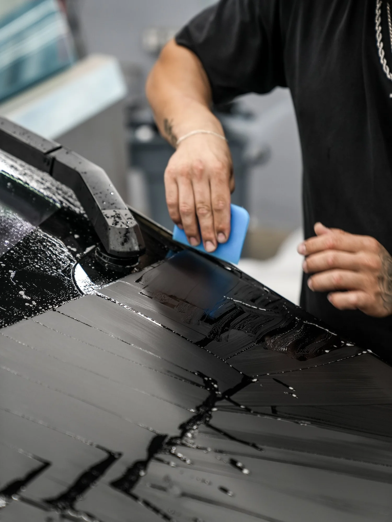 Tesla Cybertruck matte black film installation on the hood after PROTEK matte black PPF and window tint