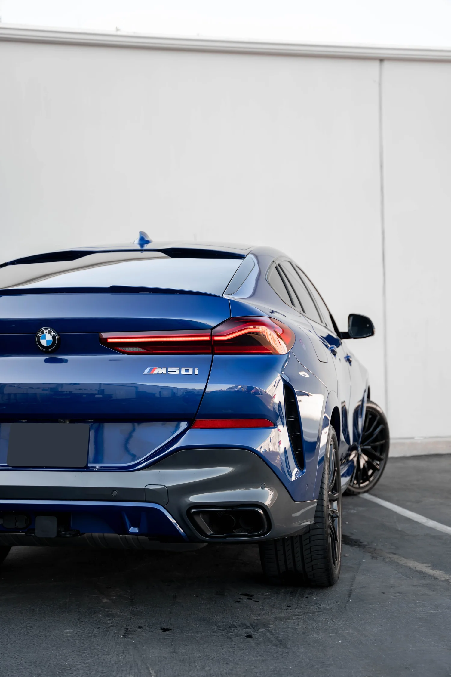 BMW X6 PPF after Paint Protection Film (PPF), low-angle rear view