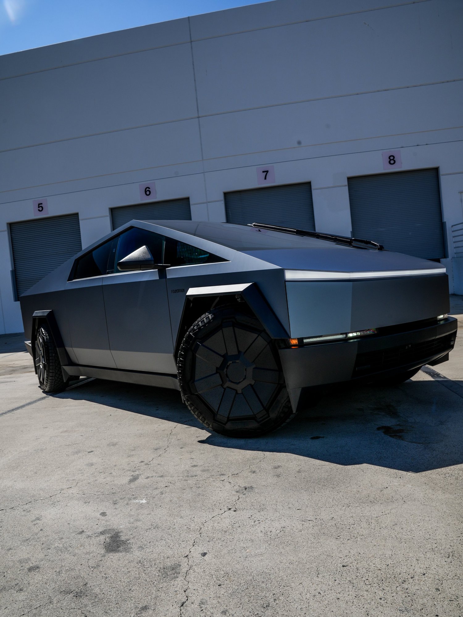 Tesla Cybertruck Ghost Metal Grey Blue after Window Tint and Vinyl Wrap, rear-right three-quarter view