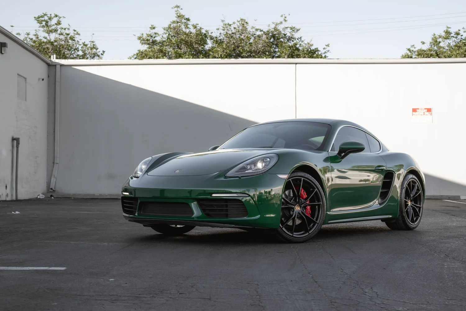Porsche 718 Cayman S Racing Green after Vinyl Wrap, front-right three-quarter view