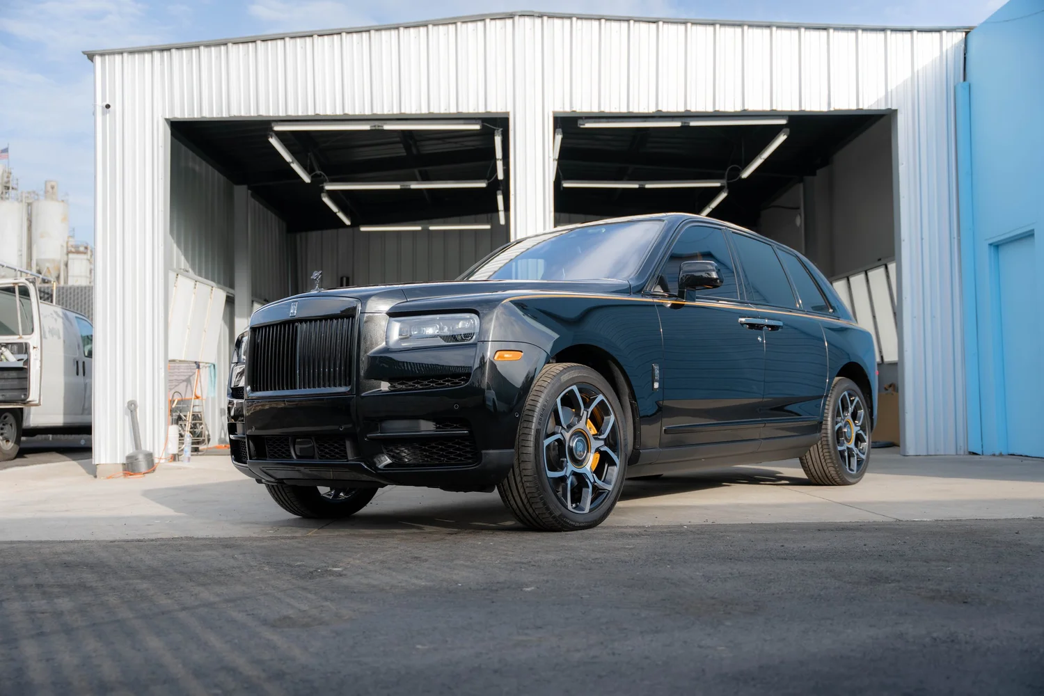 Black Rolls-Royce Cullinan Black Badge with Yellow Brake Calipers after Paint Protection Film (PPF), Window Tint and Ceramic Coating, front-left three-quarter view
