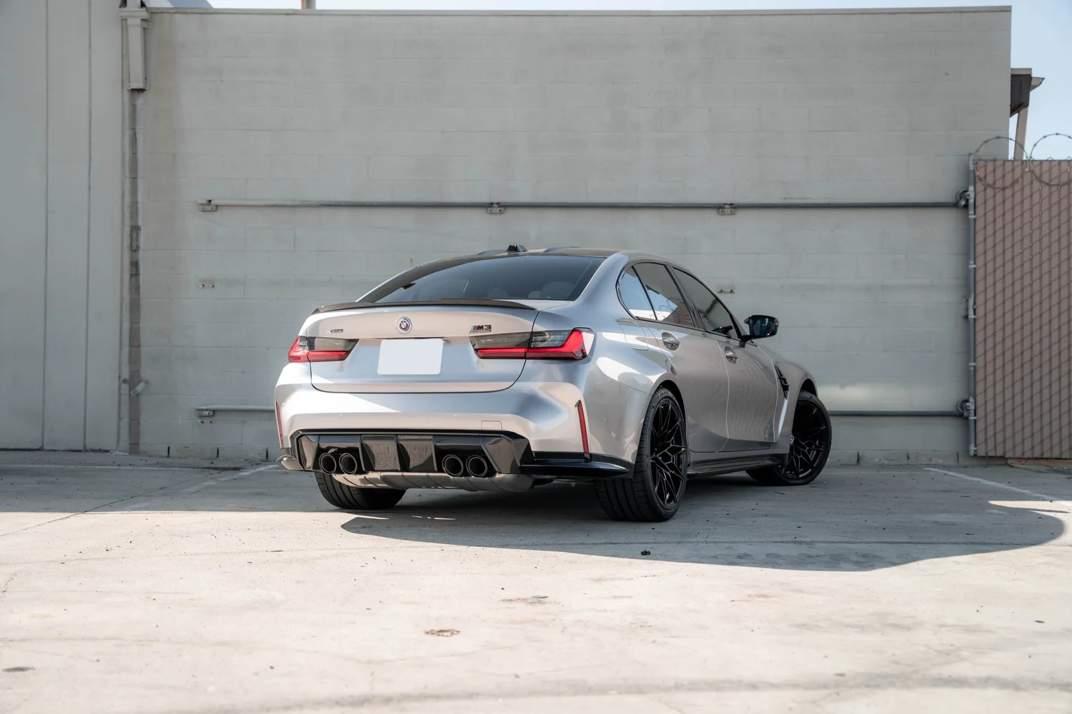 BMW M3 Gloss Silver Vinyl Wrap, rear three-quarter view