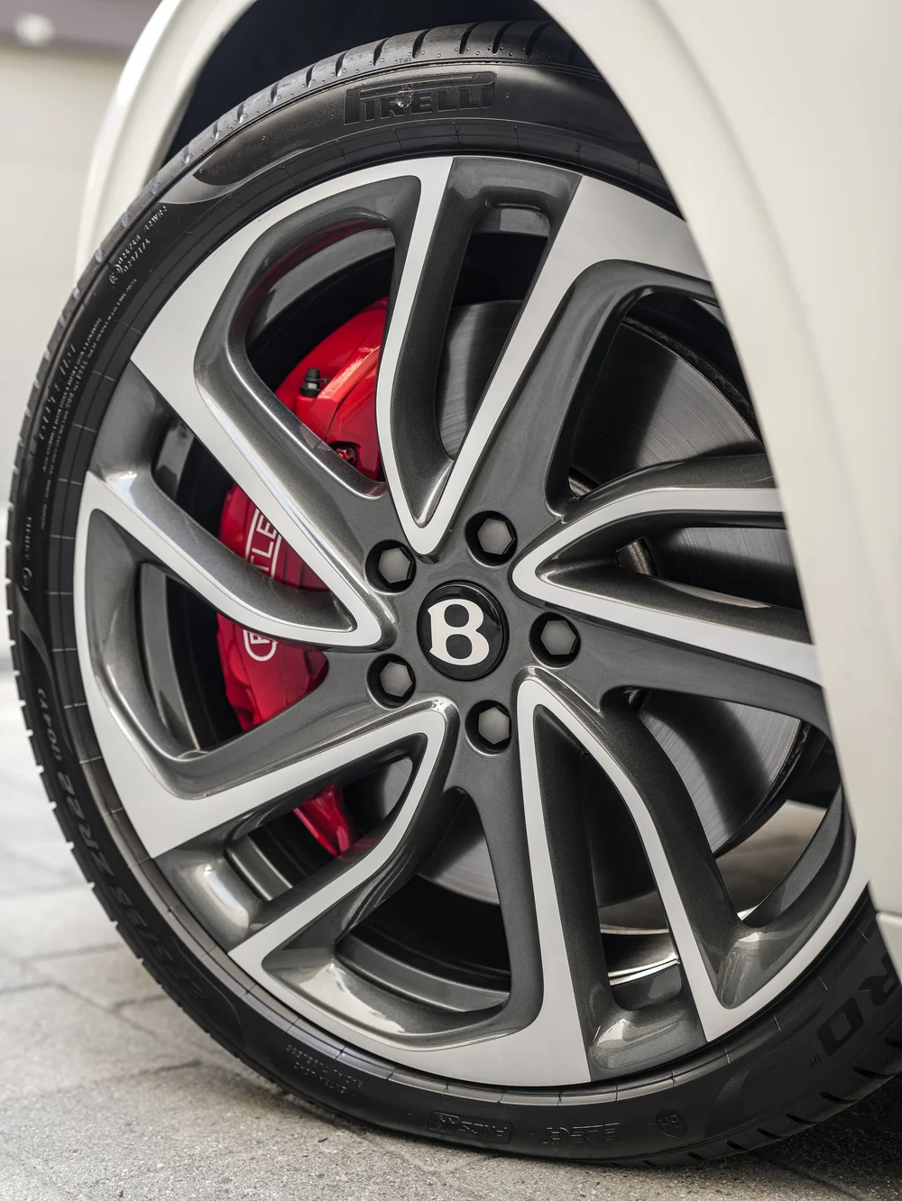 Bentley Flying Spur Speed wheel detail showing the Bentley center cap and red brake caliper