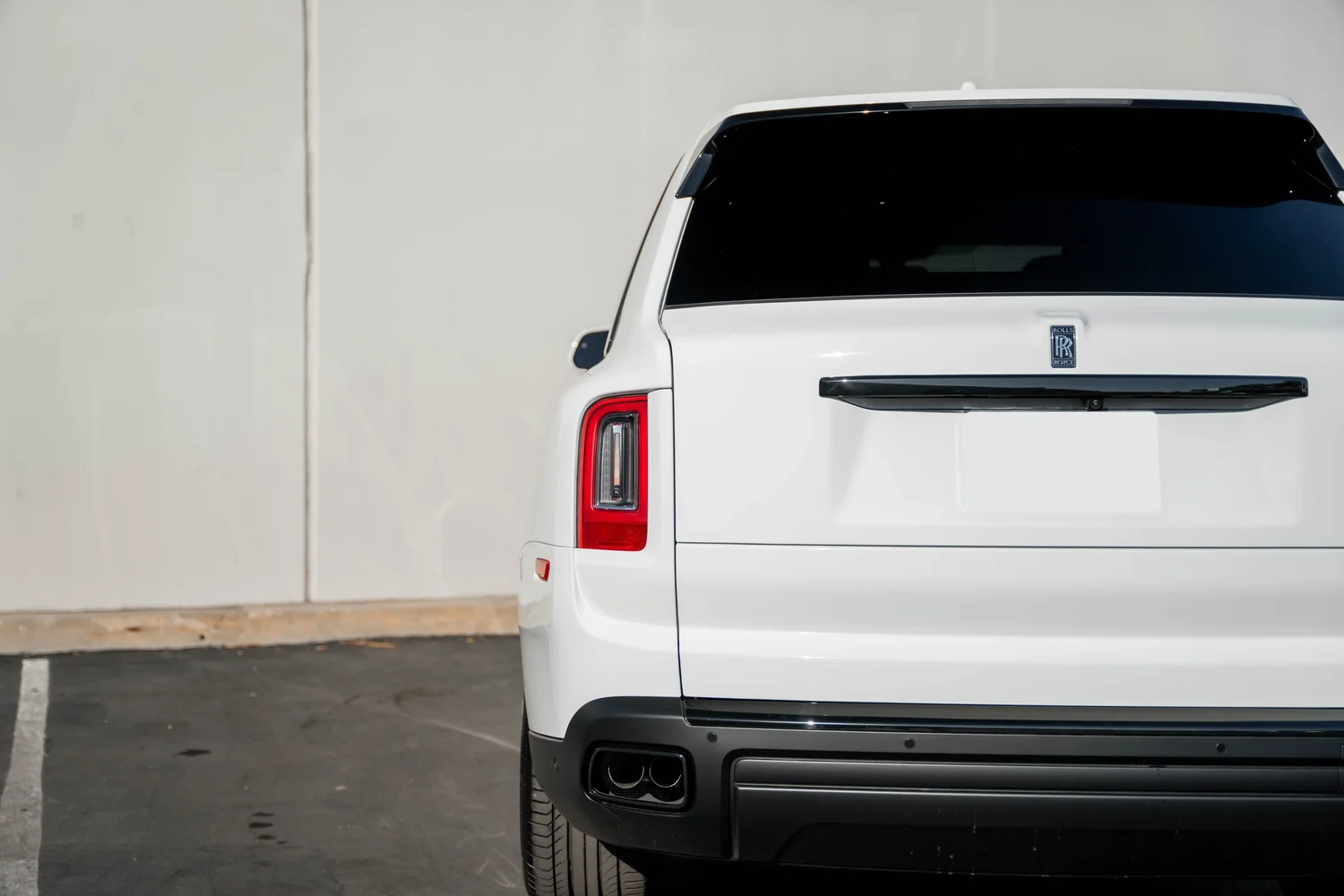 White Rolls-Royce Cullinan after Paint Protection Film (PPF), Window Tint and Ceramic Coating, rear-quarter and wheel view
