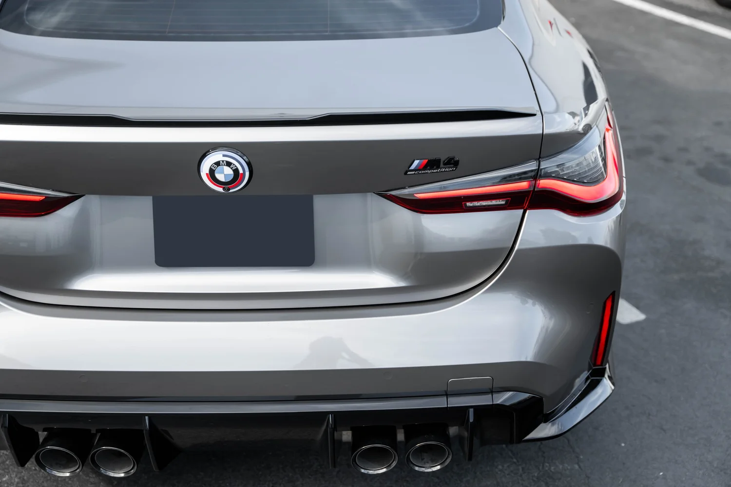BMW M4 Silver Vinyl Wrap, rear badge and taillight detail