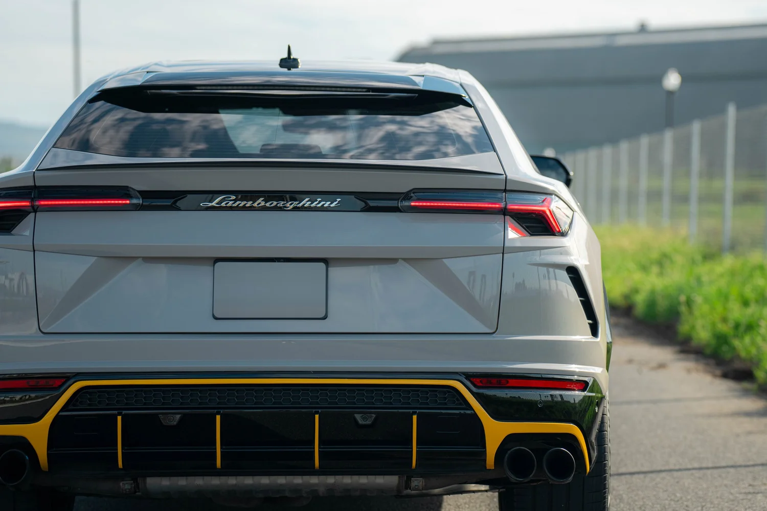 Lamborghini Urus Chalk after Vinyl Wrap, rear diffuser and exhaust detail