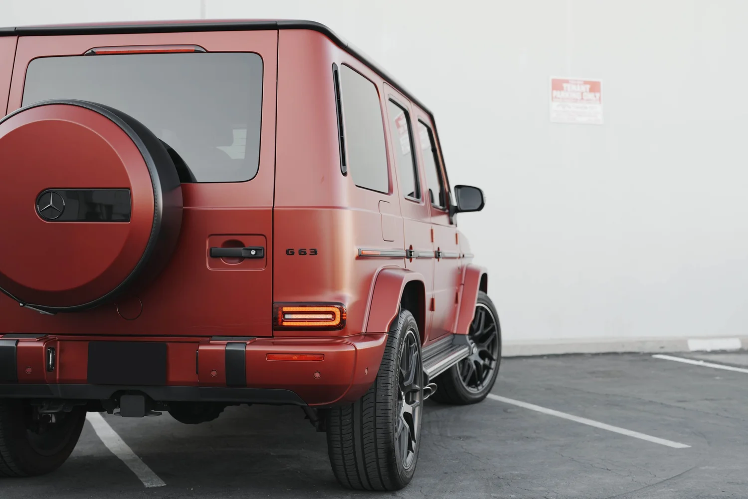 Red Mercedes-AMG G 63 after Matte PPF, Window Tint and Ceramic Coating, low-angle rear view