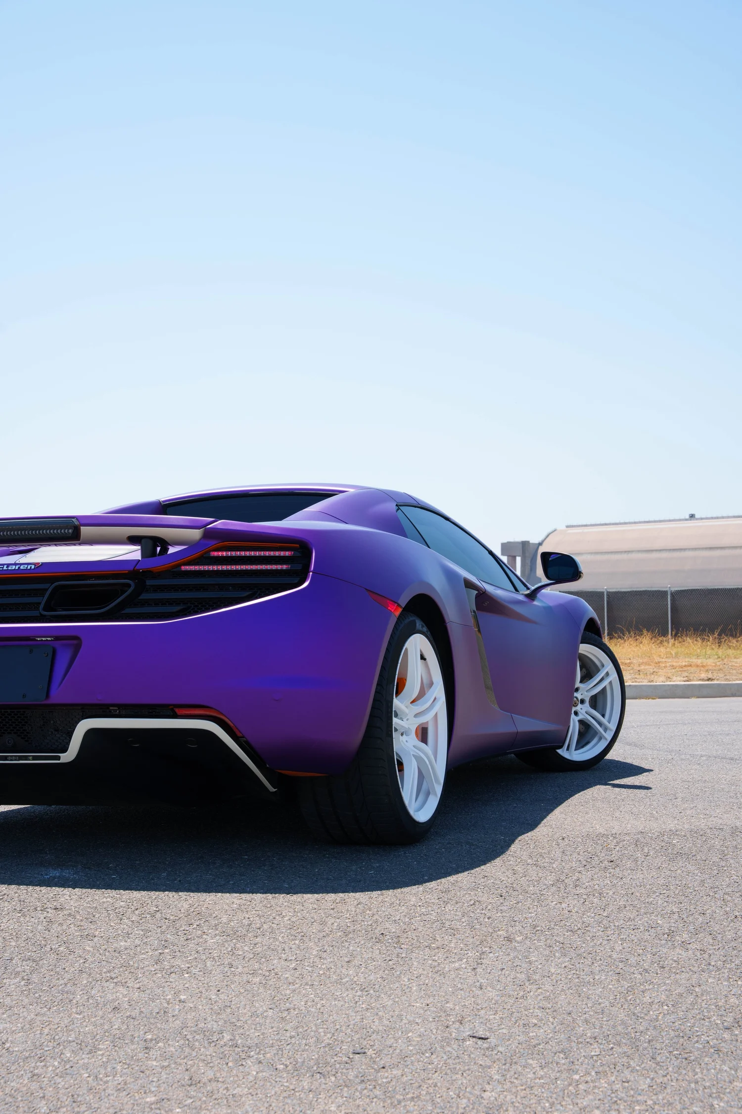 McLaren MP4-12C after Vinyl Wrap, low-angle rear view