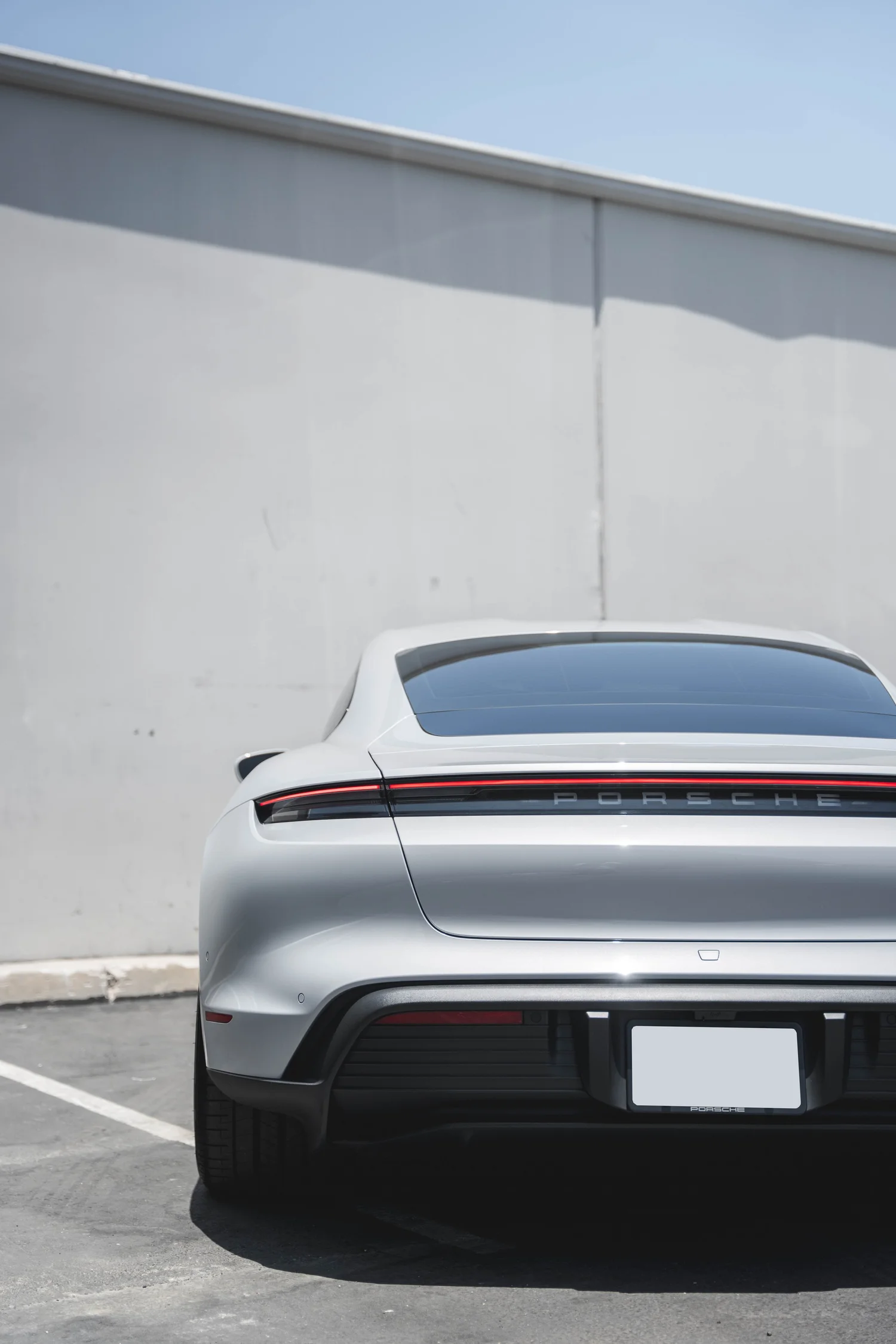 Porsche Taycan after Paint Protection Film (PPF), Window Tint and Ceramic Coating, rear bumper and taillight detail
