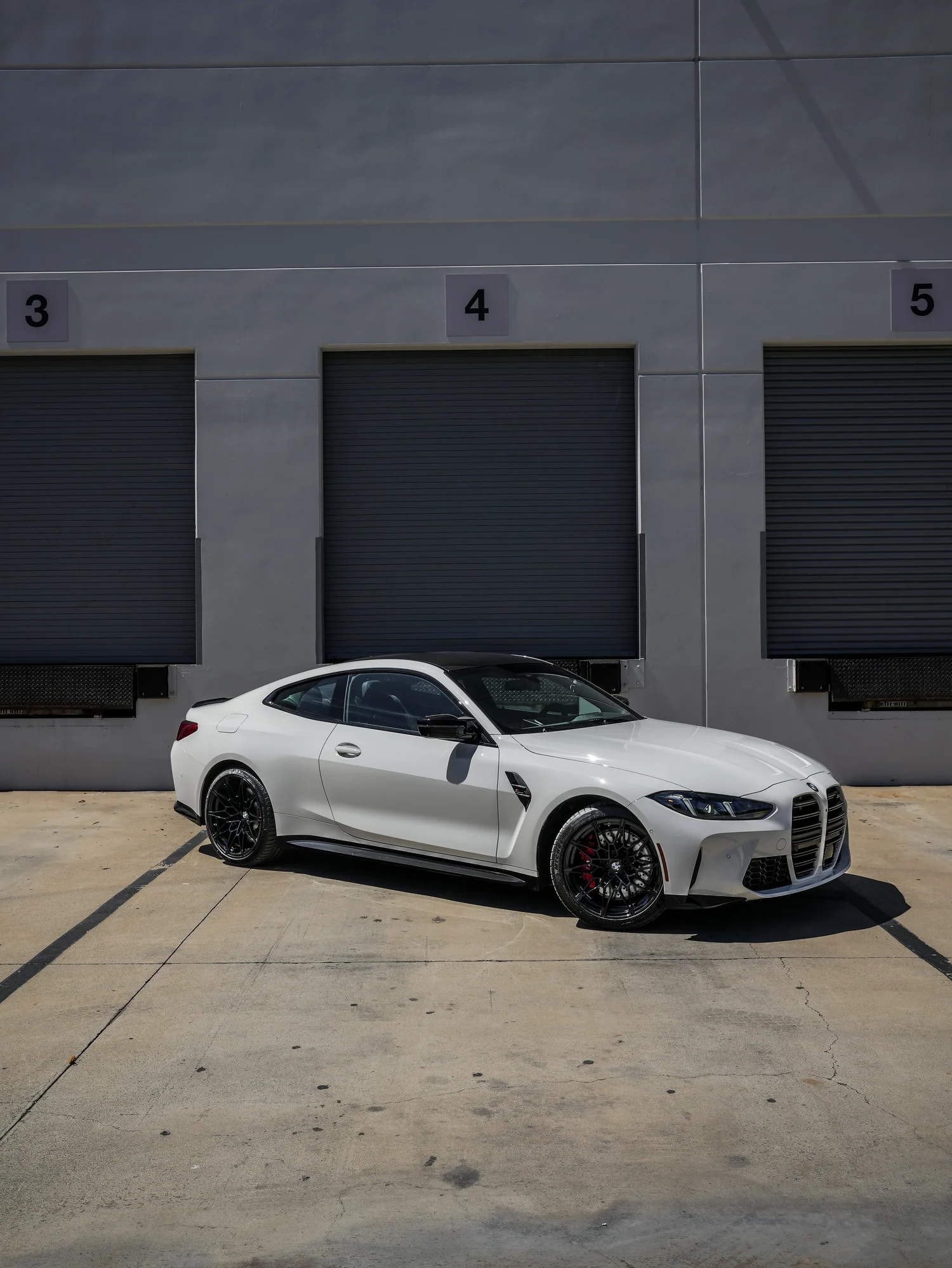 BMW G82 M4 after Paint Protection Film (PPF), front-left three-quarter view