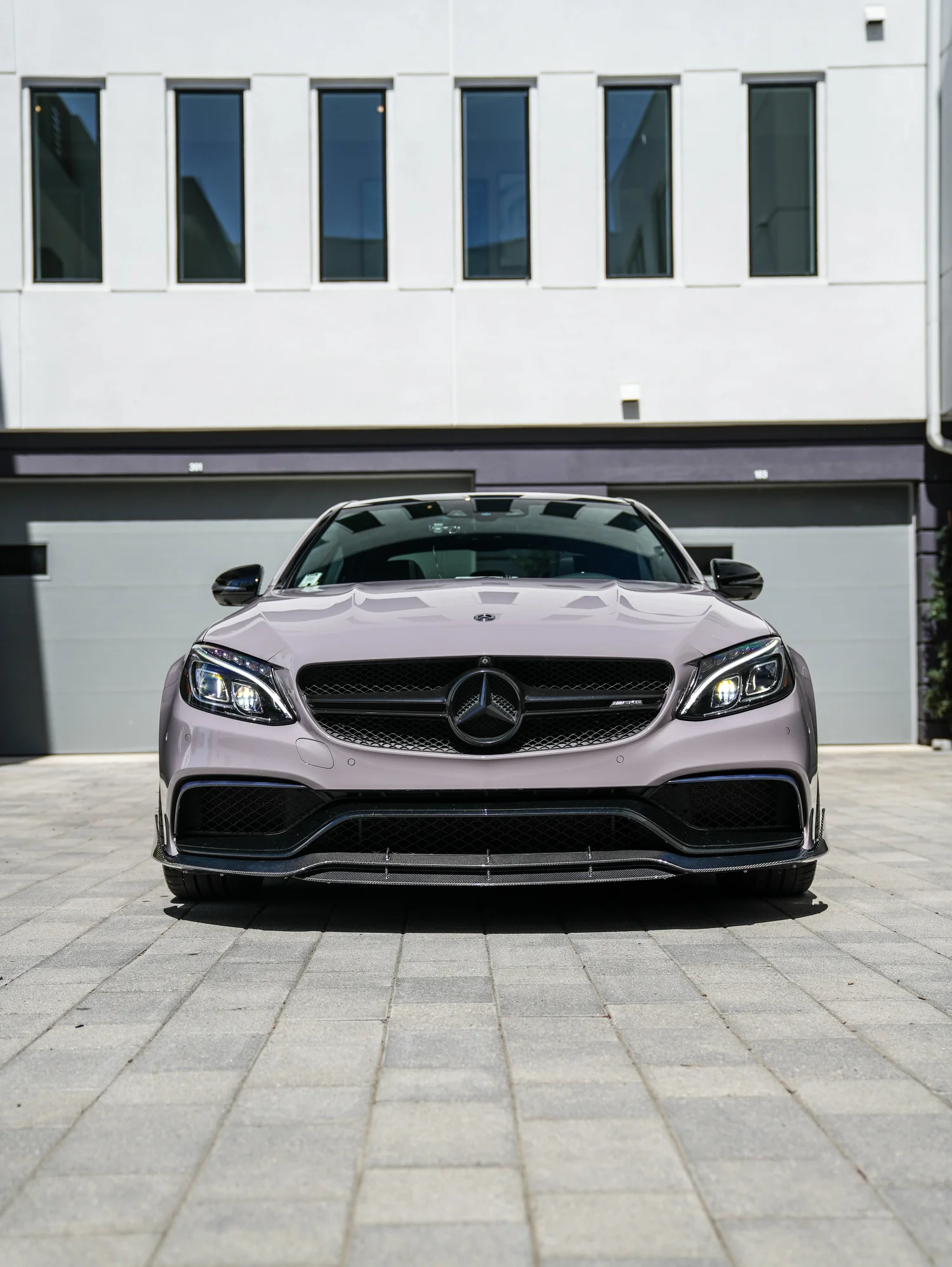 Mercedes-AMG C 63 S Inozetek Pigeon Grey after Vinyl Wrap, low-angle front view