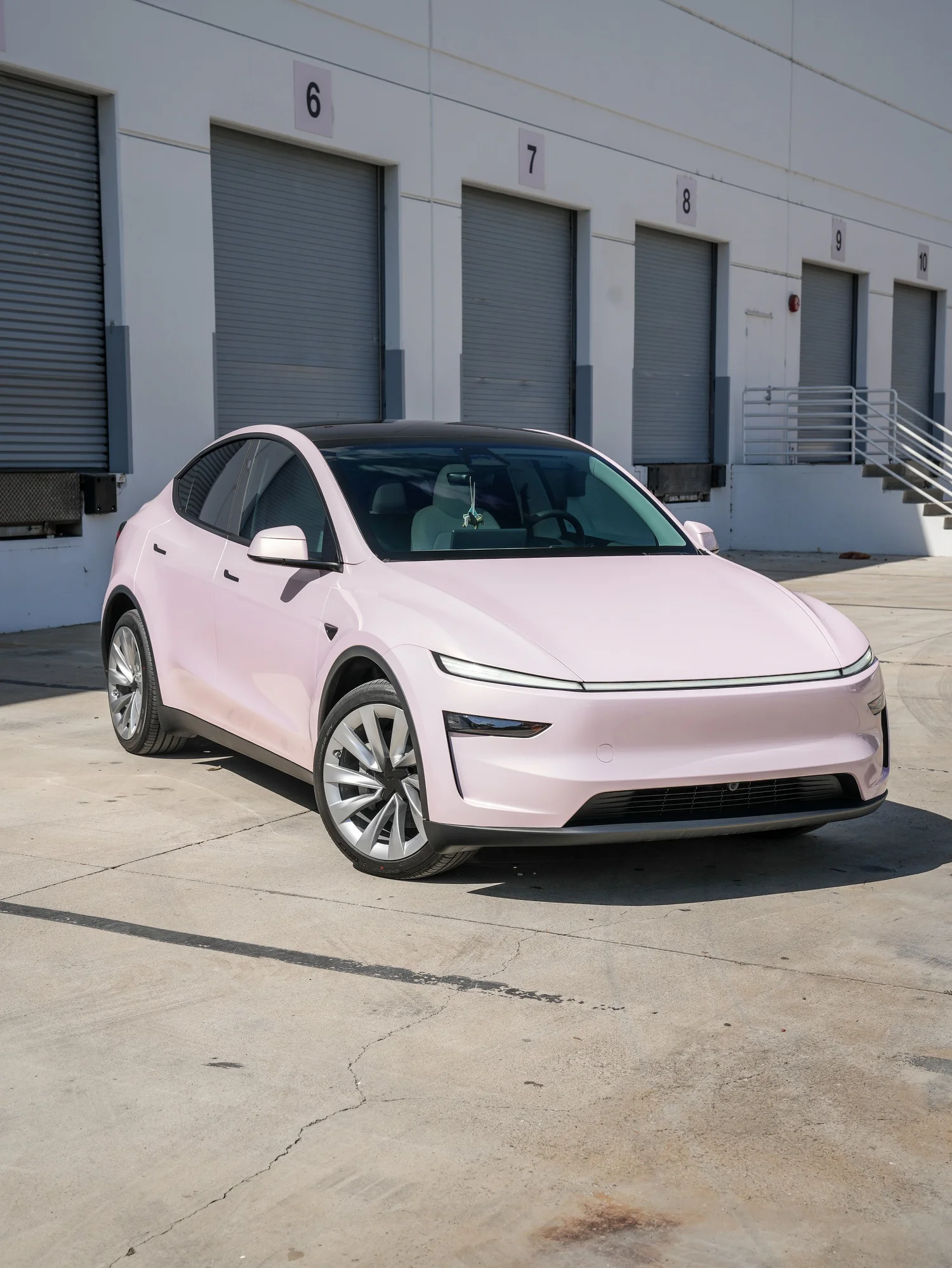 Tesla Model Y Champagne Pink after Vinyl Wrap, front-left three-quarter view