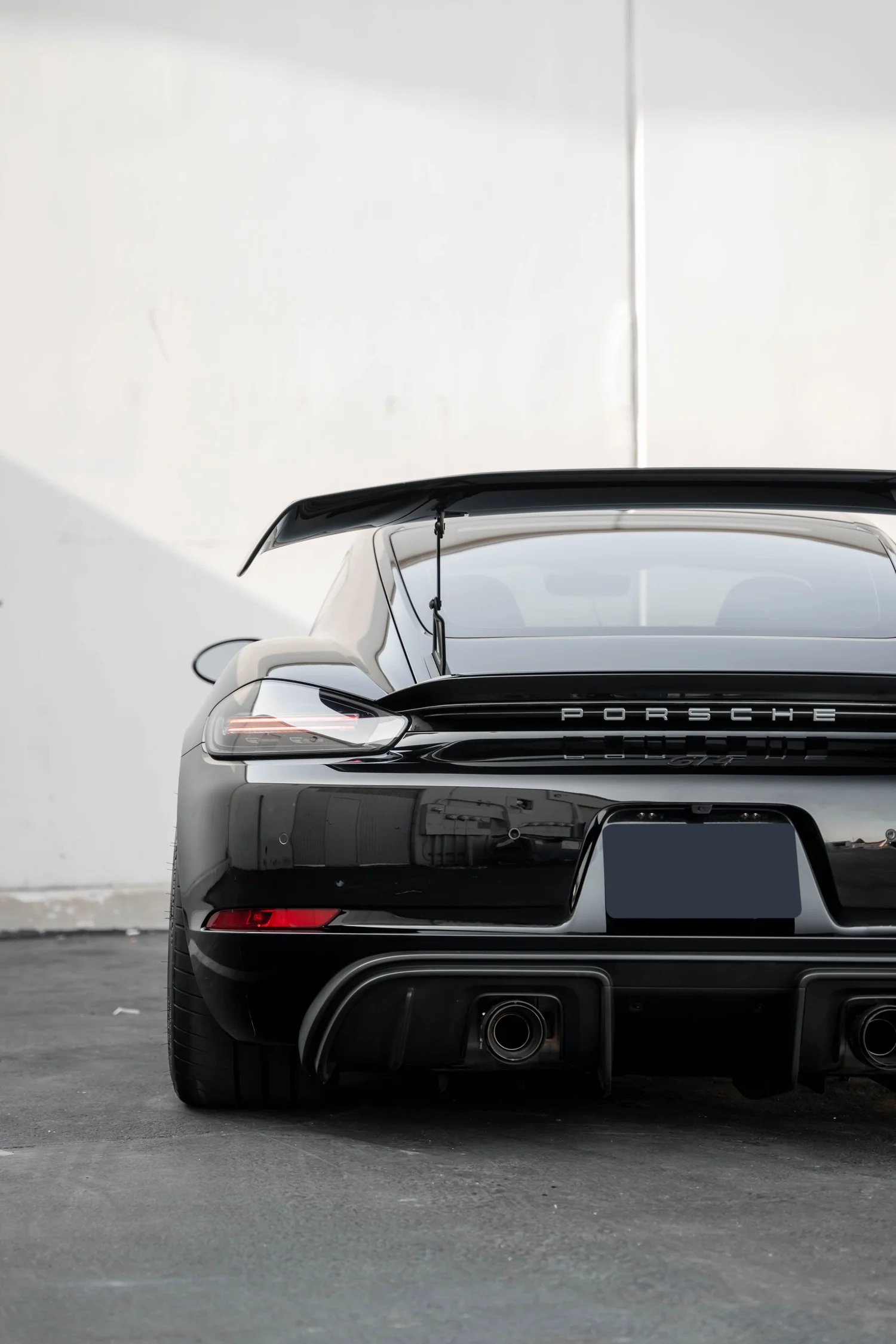 Porsche 718 Cayman GT4 after Paint Protection Film (PPF), Window Tint and Ceramic Coating, rear diffuser and exhaust detail