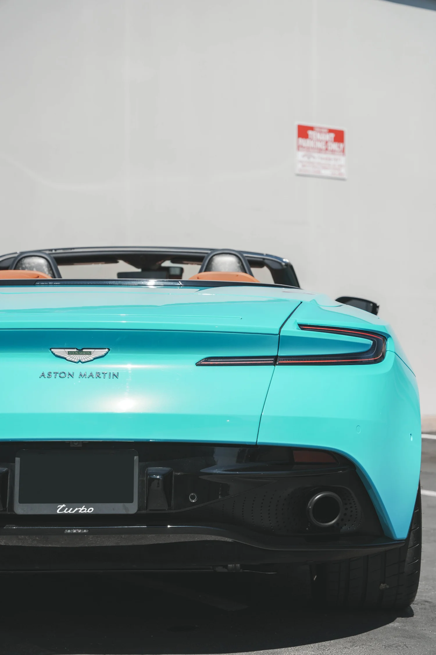 Aston Martin DB11 Miami Blue after Vinyl Wrap, rear body and taillight view