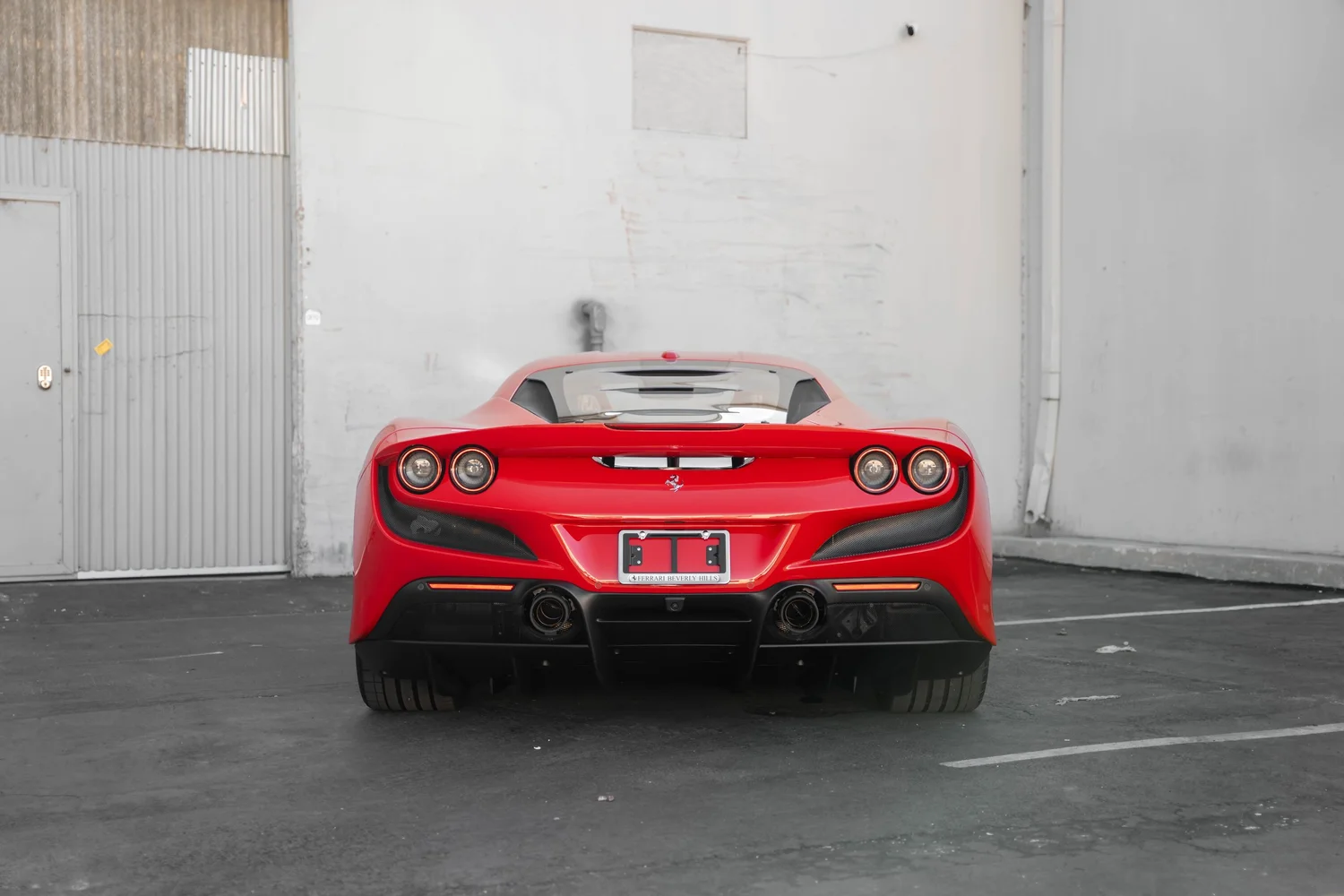 Rosso Corsa Ferrari F8 after Paint Protection Film (PPF), Window Tint and Ceramic Coating, rear-right three-quarter view