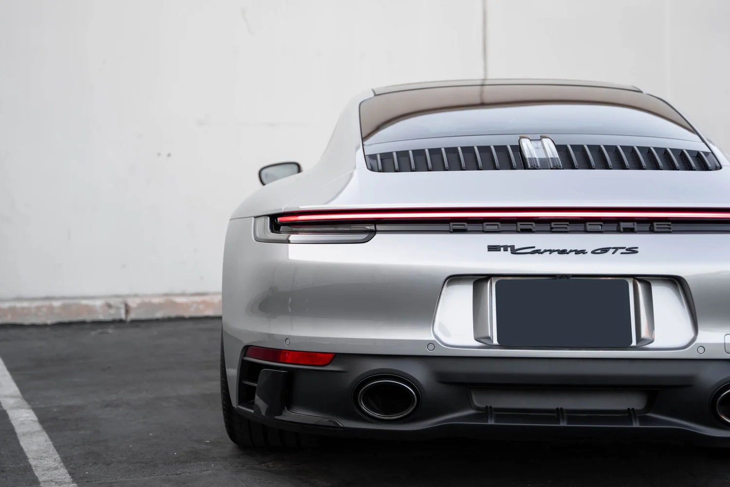 Porsche 911 Carrera GTS (992.1) after Paint Protection Film (PPF), Window Tint, Ceramic Coating and Custom Graphics, rear diffuser and exhaust detail