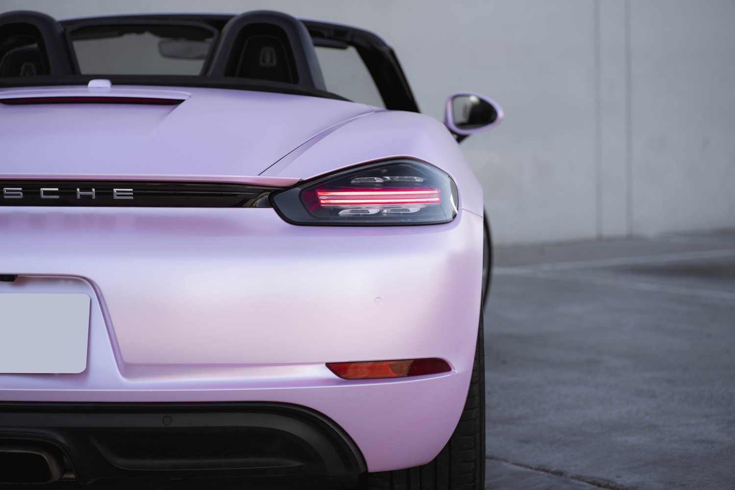 Porsche 718 Boxster Matte Purple Pink after Vinyl Wrap, front-corner view