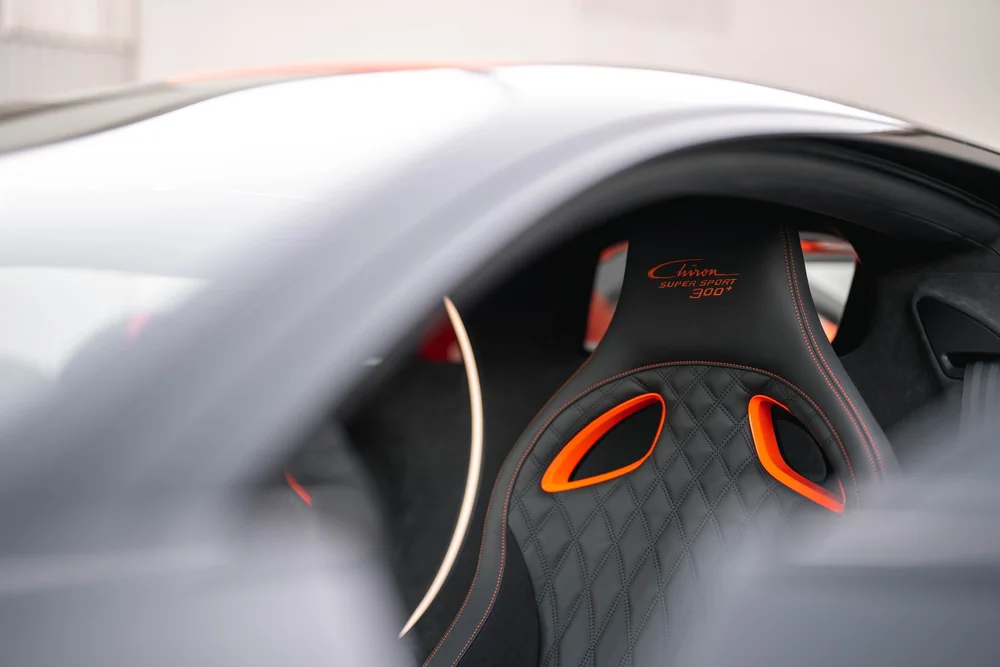 Bugatti Chiron Super Sport 300+ seat with orange openings seen through the side window