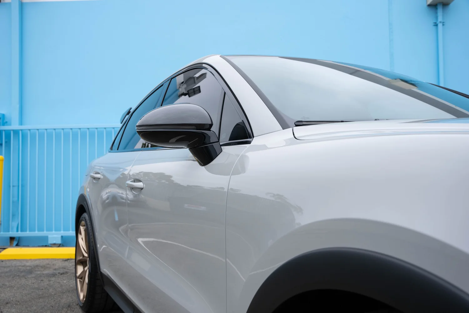 Porsche Cayenne Turbo GT driver-side mirror and tinted side glass after PPF, window tint and ceramic coating