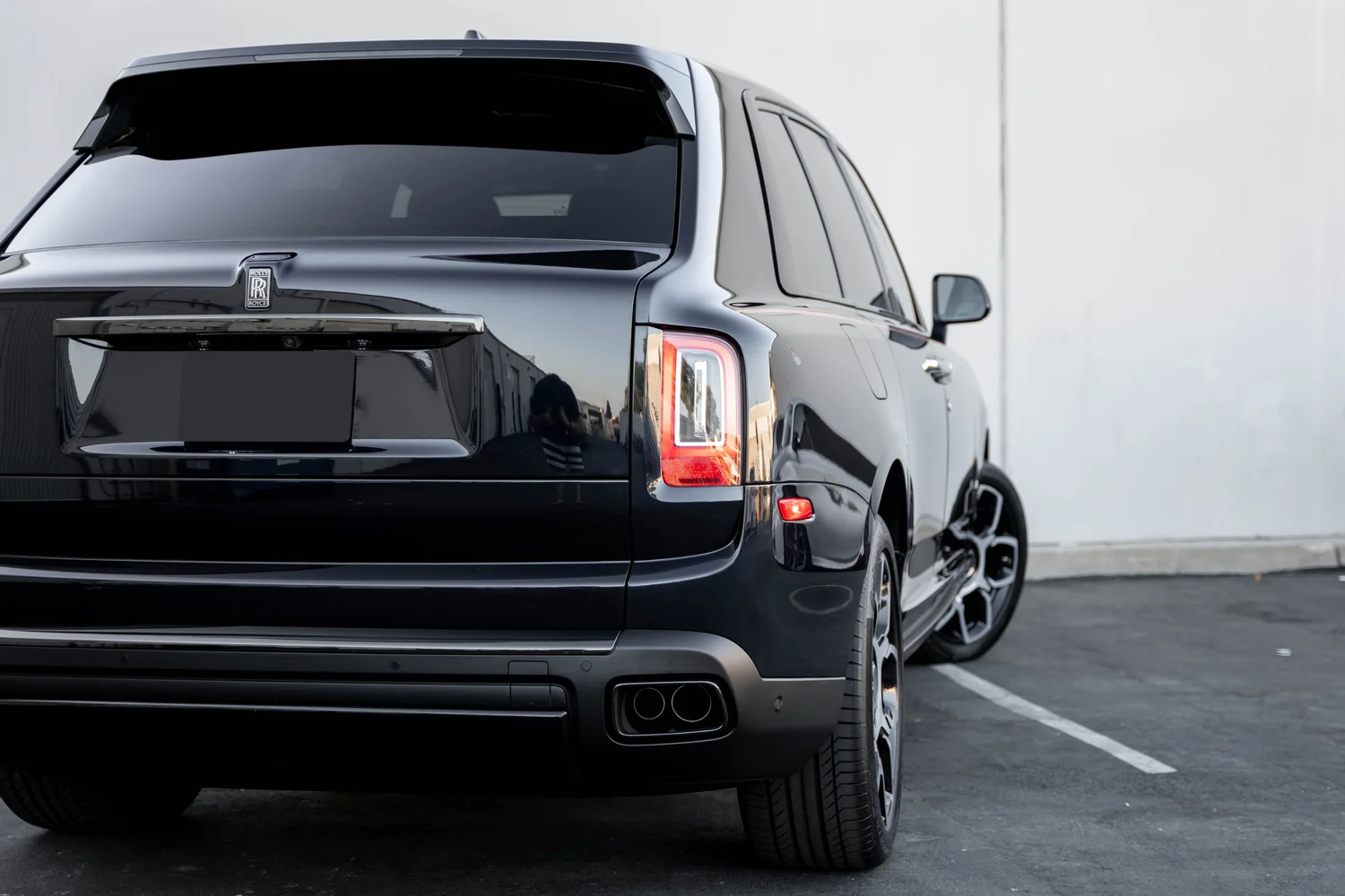 Black Rolls-Royce Cullinan Black Badge after Paint Protection Film (PPF), Window Tint and Ceramic Coating, tight rear three-quarter view