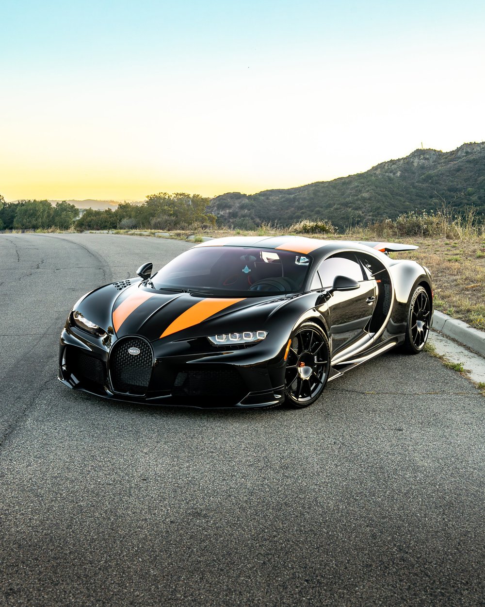 Front three-quarter view of the black Bugatti Chiron Super Sport 300+ on a mountain road