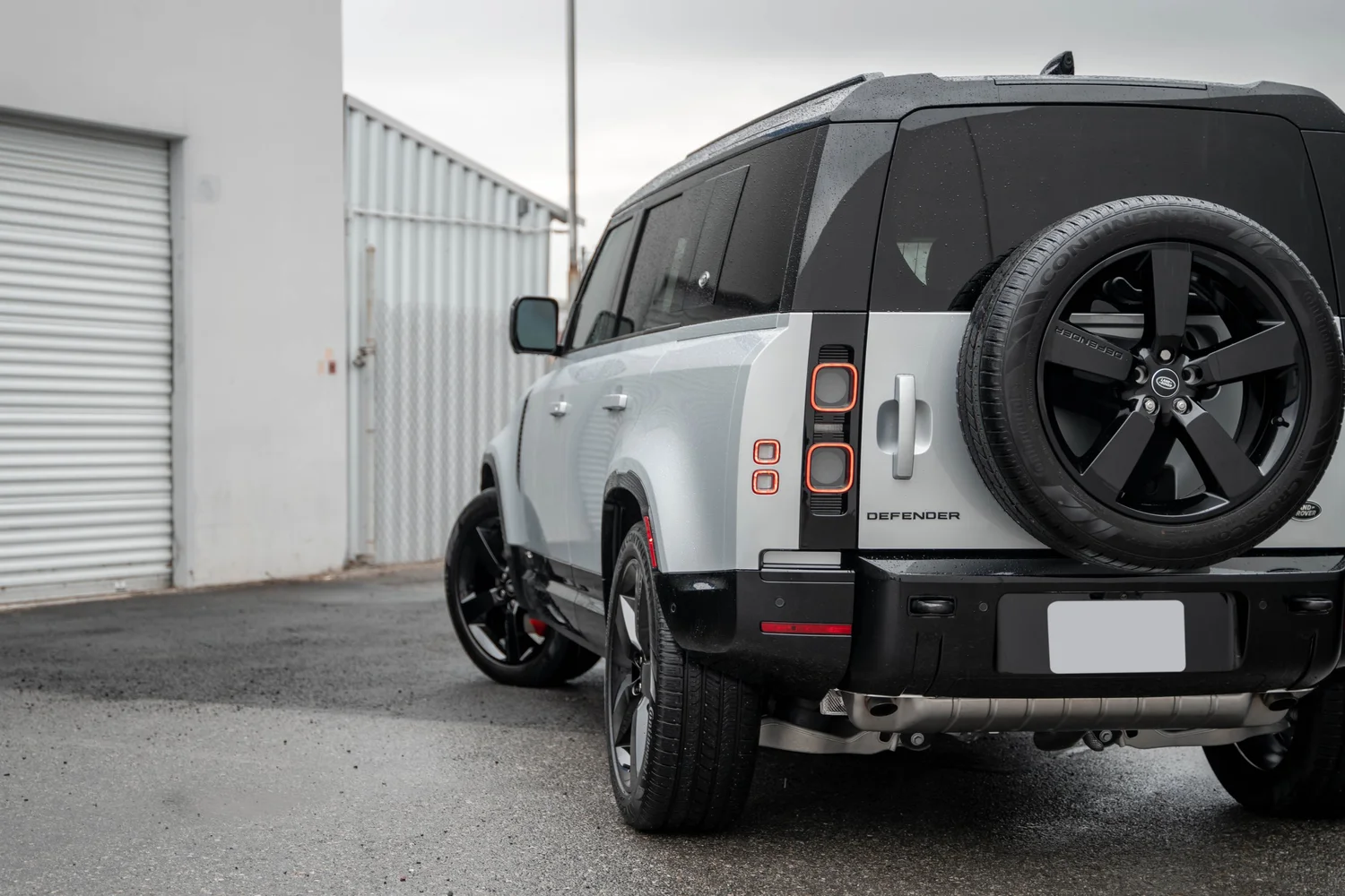 Land Rover Defender after Paint Protection Film (PPF), Window Tint and Ceramic Coating, rear-left three-quarter view