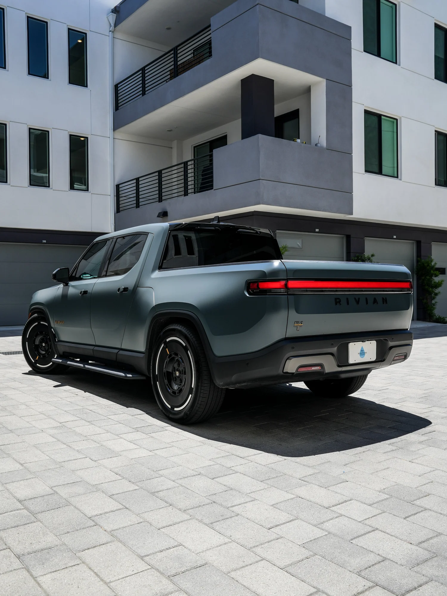 Rivian R1T after Matte PPF and Window Tint, rear-right three-quarter view