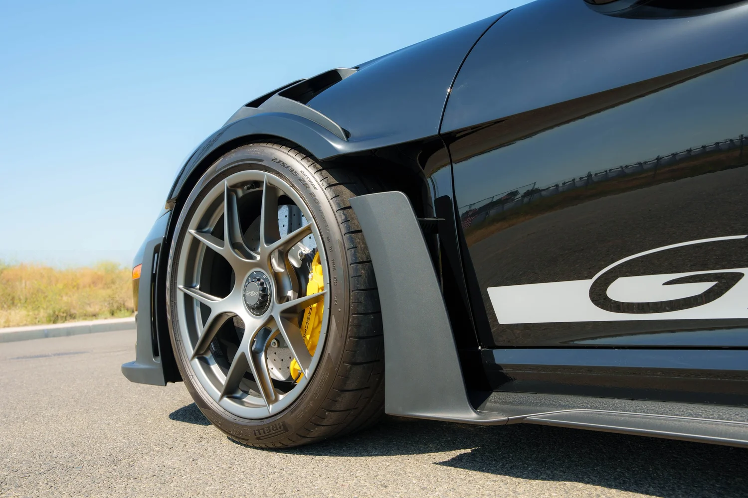 Black Porsche GT3 RS front wheel fender vent and side PPF detail