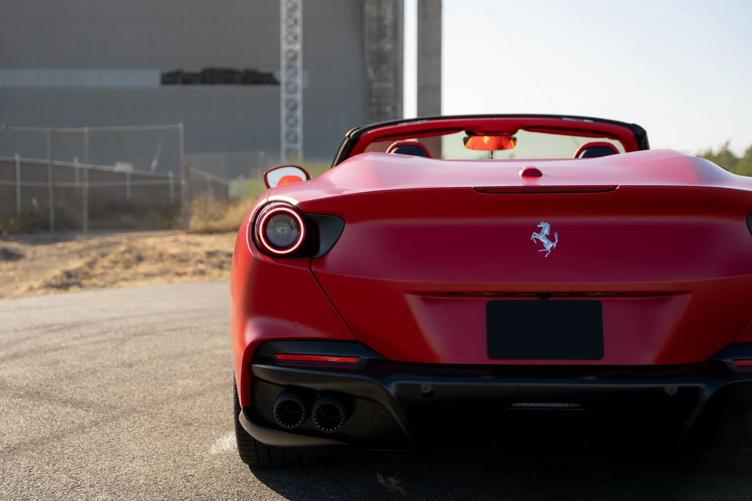 Ferrari Portofino after Matte PPF, Window Tint and Ceramic Coating, low-angle rear view