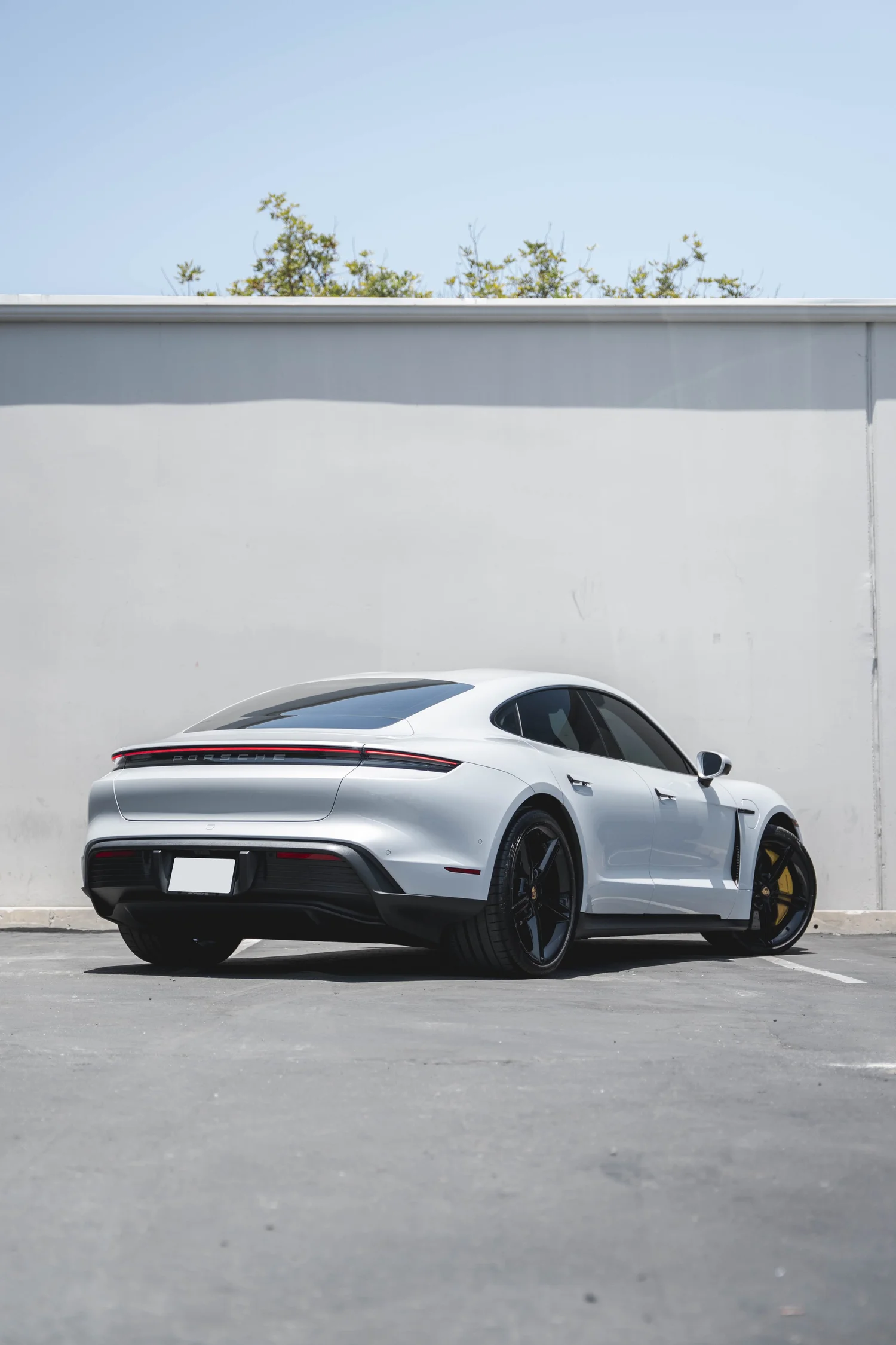Porsche Taycan after Paint Protection Film (PPF), Window Tint and Ceramic Coating, rear-right three-quarter view